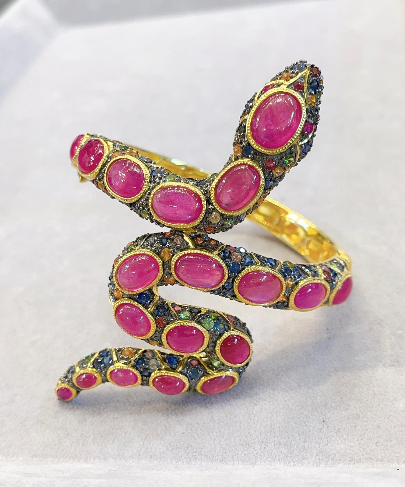 Bochic “Orient” Serpent Fancy Sapphire & Ruby bangle Set In 18K Gold & Silver 

Bochic Serpent Fancy Sapphire & Ruby Ring 
Ruby Natural Cabochon 
Pink Natural Sapphire 
Green Natural Sapphire
Rose Natural Sapphire 
Light Blue Natural Sapphire
Red