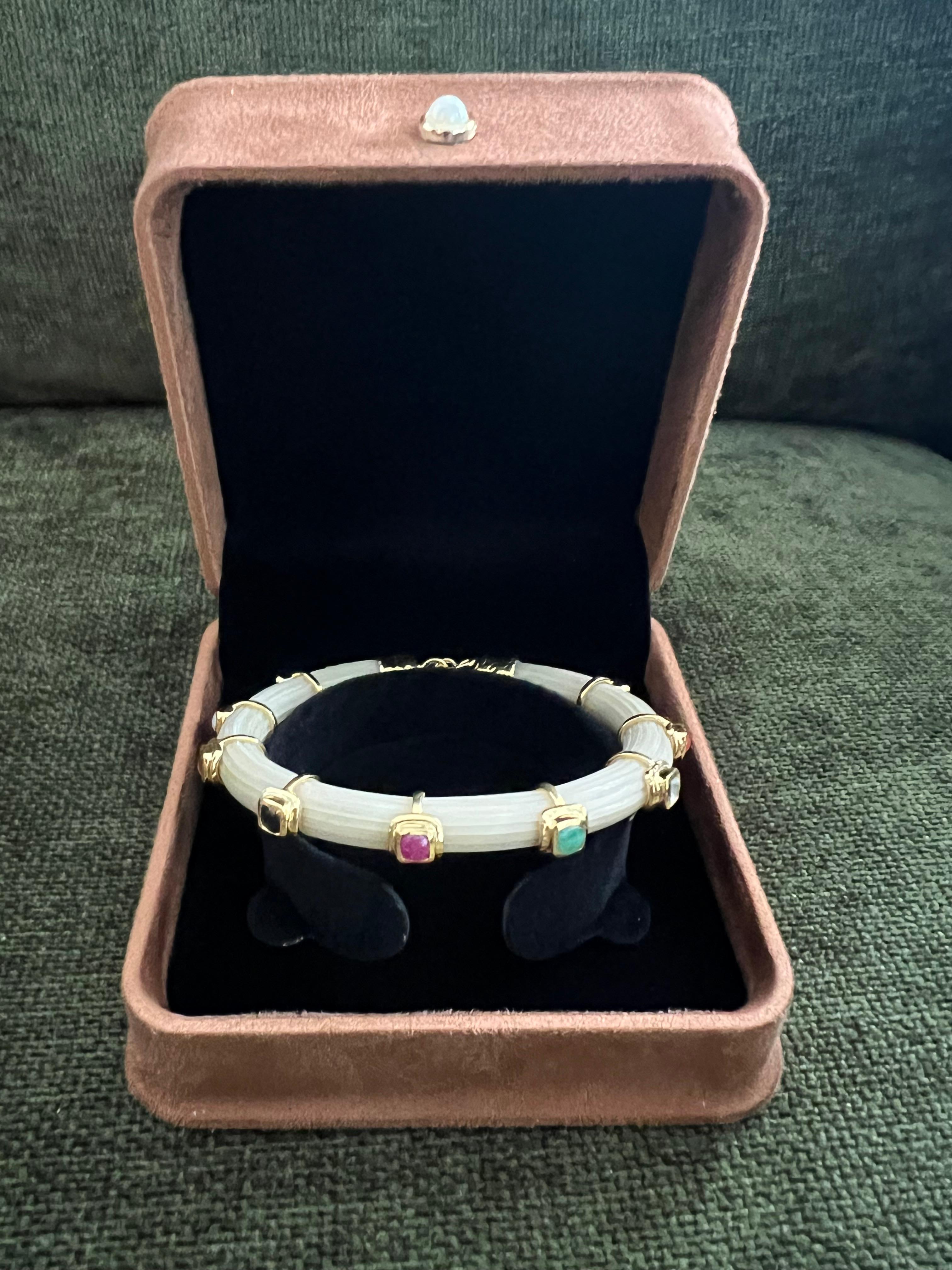 Bochic “Capri” Ruby & Multi Color Sapphire Bangle Set In 18K Gold & Silver
open and close hinge and safety locks 

Natural Red Ruby  - 3 Carats 
Natural Blue Sapphire - 4 Carats 
Natural Honey Sapphire  - 5 Carats 

The Bochic 