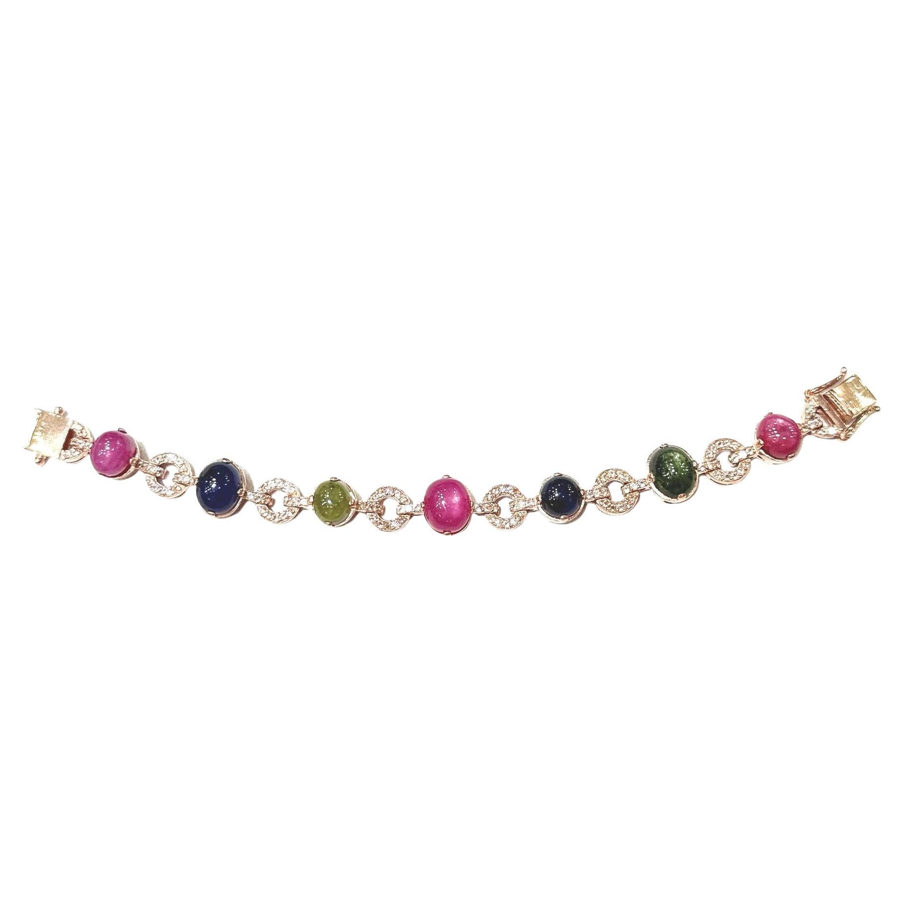 Bochic “Capri” Ruby & Multi Color Sapphire Bracelet  Set In 18K Gold & Silver
open and close hinge and safety locks 

Natural Red Ruby  -9 Carats 
Natural Blue Sapphire - 5 Carats 
Natural Green Sapphire  - 5 Carats 
Natural White Topaz - 2 Carats
