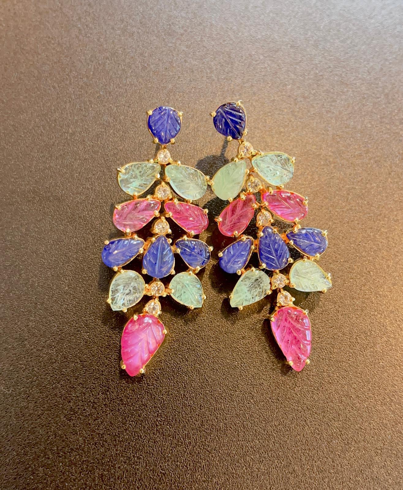 Bochic “Capri” Sapphire, Ruby and Emerald Earrings 
Natural Carved Ruby - 9 carats 
Natural Carved Sri Lankan Sapphire - 8 carats
Natural Carved Zambian Emerald - 7 - carats 
Natural White Topaz - 1 carat 
The earrings are fancy colors and light,