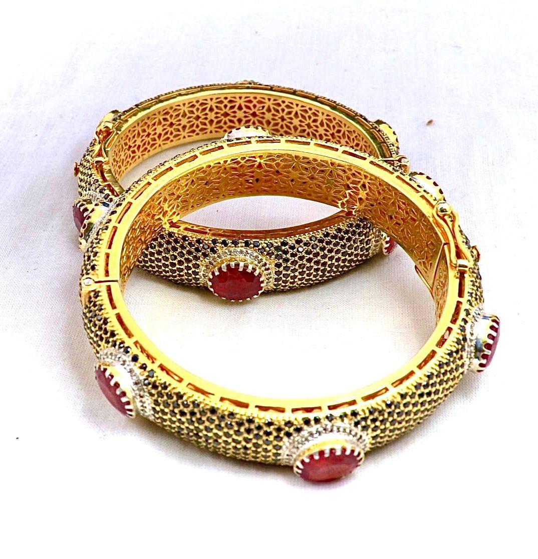 Bochic “Capri” Sapphire, Ruby & Diamond Bangle Set In 18K Gold & Silver

Natural Blue Sapphire - 4 Carat
Natural Rubies - 14 Carat 
Natural Diamonds - 3 Carat 

This Bangle is from the 