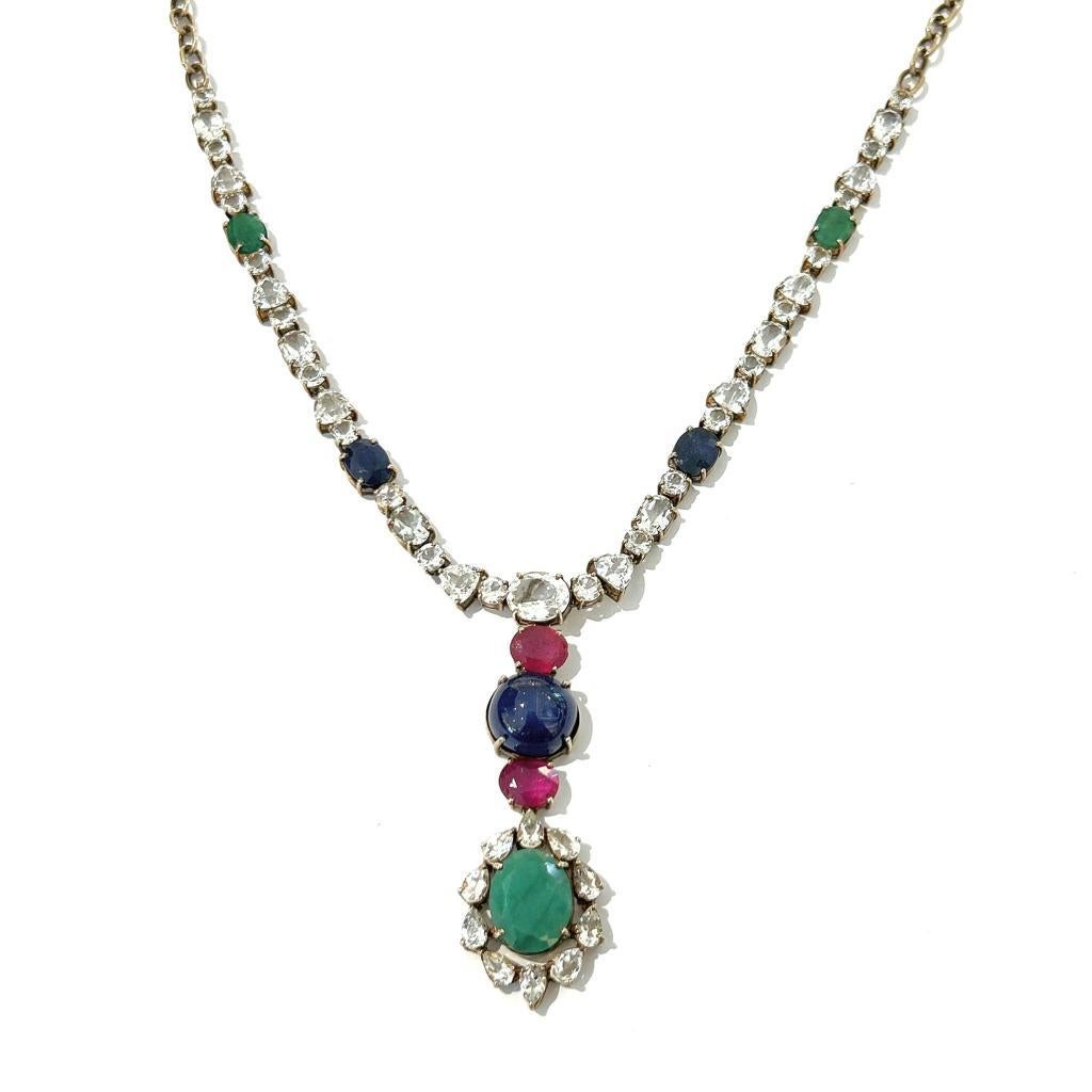 Bochic “Capri” Sapphire, Ruby & Emerald Necklace Set In 18K Gold & Silver 

Natural Blue Sapphire Cabochon from Sri Lanka 
27 Carat 
Natural Green Emerald Oval Shape from Zambia 
11 Carat
Natural Oval Shape Rubies From Africa 
4 Carat
Natural White