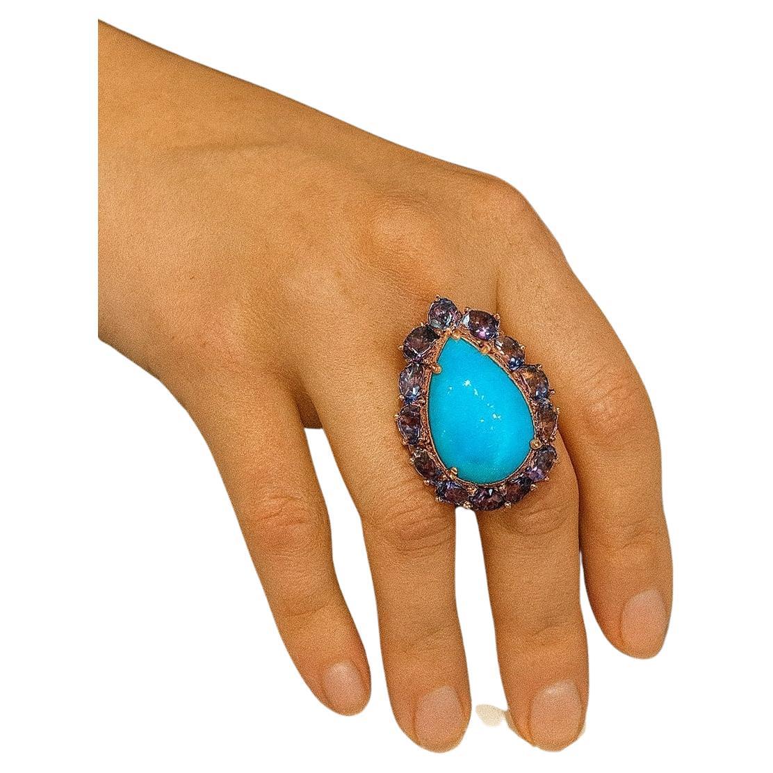 Bochic “Capri” Vintage Turquoise & Tanzanite Ring Set In 18K White Gold & Silver 

Natural Pear Shape Turquoise
9 carat 
Natural Tanzanite 
4 carat 

This Ring is from the 