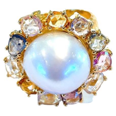 Bochic “Capri” White South Sea Pearl & Rose cut Sapphires Ring Set in 18K Gold & Silver 
Natural Rose cut multi color sapphires  - 12 Carats 
White Natural south sea pearl, round

This Ring is from the 