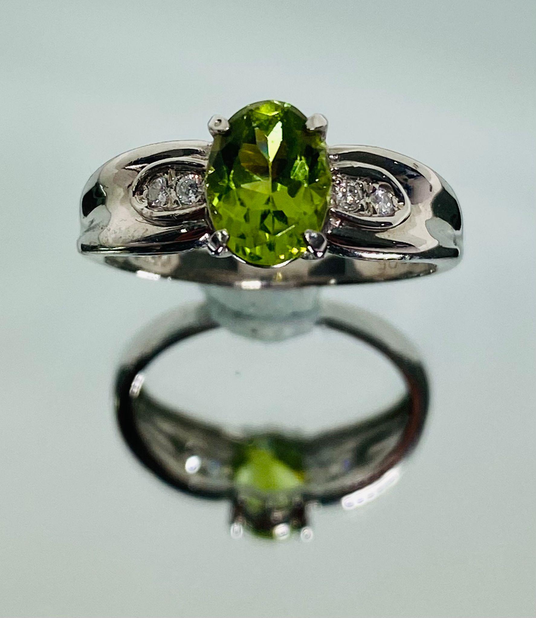 Bochic Classic & Elegant Platinum Cluster Diamond & Green Peridot Ring 

Bochic Platinum 900 Cluster Diamond
Natural Green Peridot 1.28 Carat 
Diamonds 0.10Carat 
Color F 
Clarity VS 
7.25 Gram 

Elegant, Classic and Chic 
The cluster ring is an