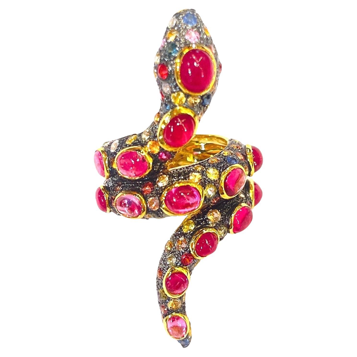 Bochic Serpent Ruby Ring & Fancy Sapphires
Real Natural Ruby Cabochons - 5 carat 
Natural Fancy color sapphires,  yellow, blue, pink and green
From Sri Lanka - 3 carats 
Black Silver & 22k Pink Gold Plating 
Comes with a Bochic Box
You will steal