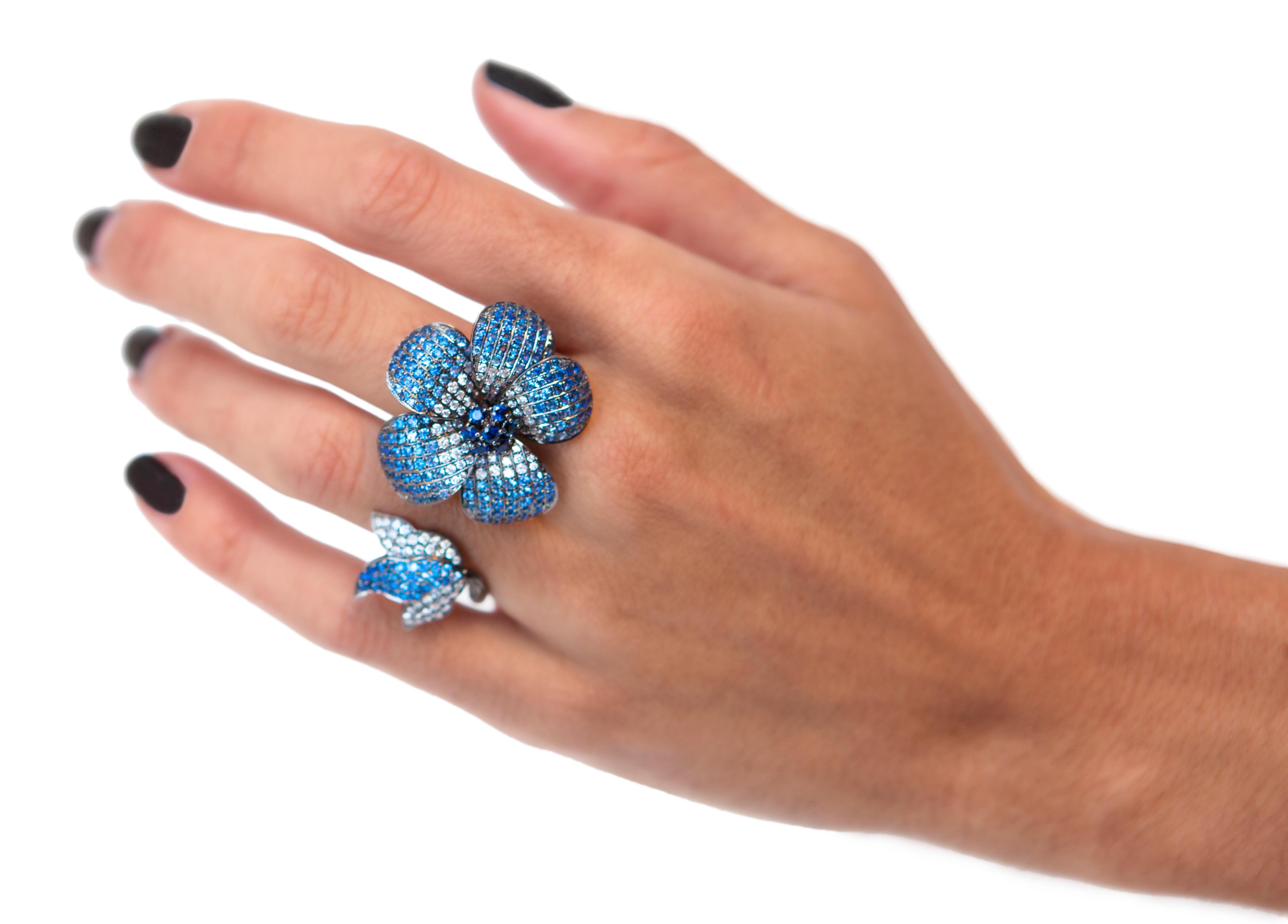 Chic, timeless and elegant this 18k White Gold Lotus Flower Diamond double shank finger ring is made to order by Bochic 
Round brilliant cut diamonds VS clarity, E color total weight approx 1,10 Carat
Round brilliant cur blue Natural Sapphires,