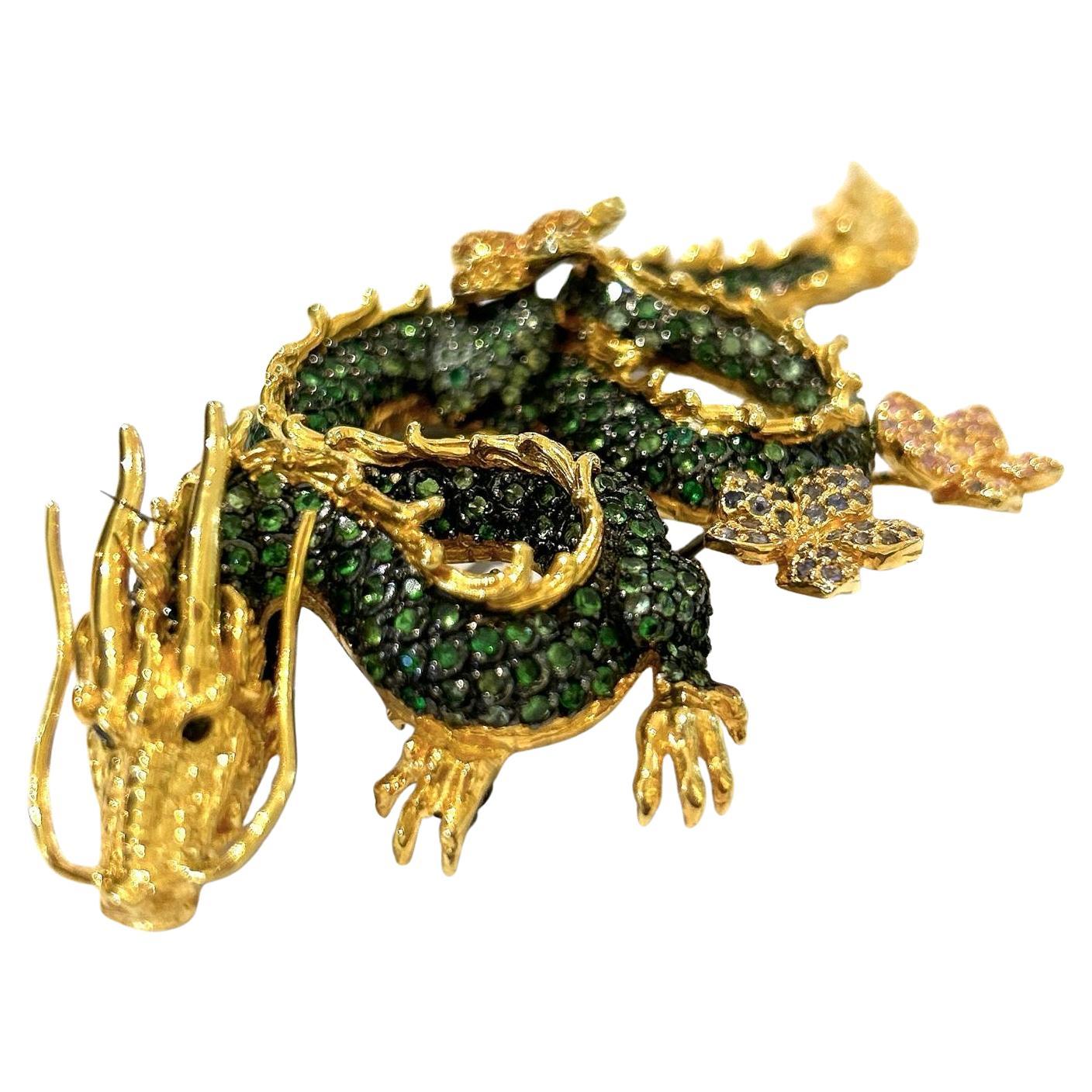 Bochic Dragon “Orient” Multi Sapphires & Tasvorite Brooch Set In 18K Gold & Silver 

Natural Tsavorite  - 4 carat 
Multi color Natural Sapphires from Sri Lanka 
3 carat
Can be worn as a pendent as well. 

The Brooch is from the 