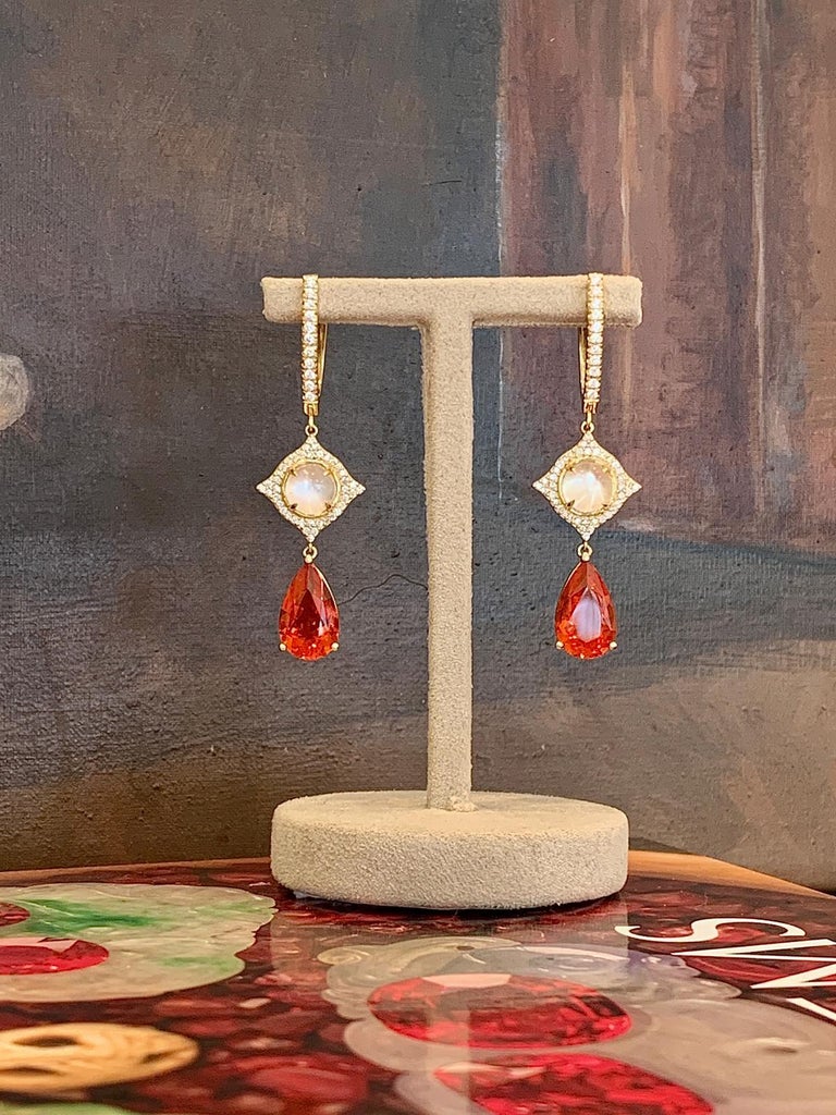 Mexican Fire opal and Moonstone earrings from Bochic. 
This is part from the “Frida” collection. 
22 White Diamonds F color VS clarity - 0.24 Carat 
2 moonstones 1.57 Carat 
2 Fire Opal ( Mexican) 2.47 Carat 
80 White Diamond F color VS Clarity -