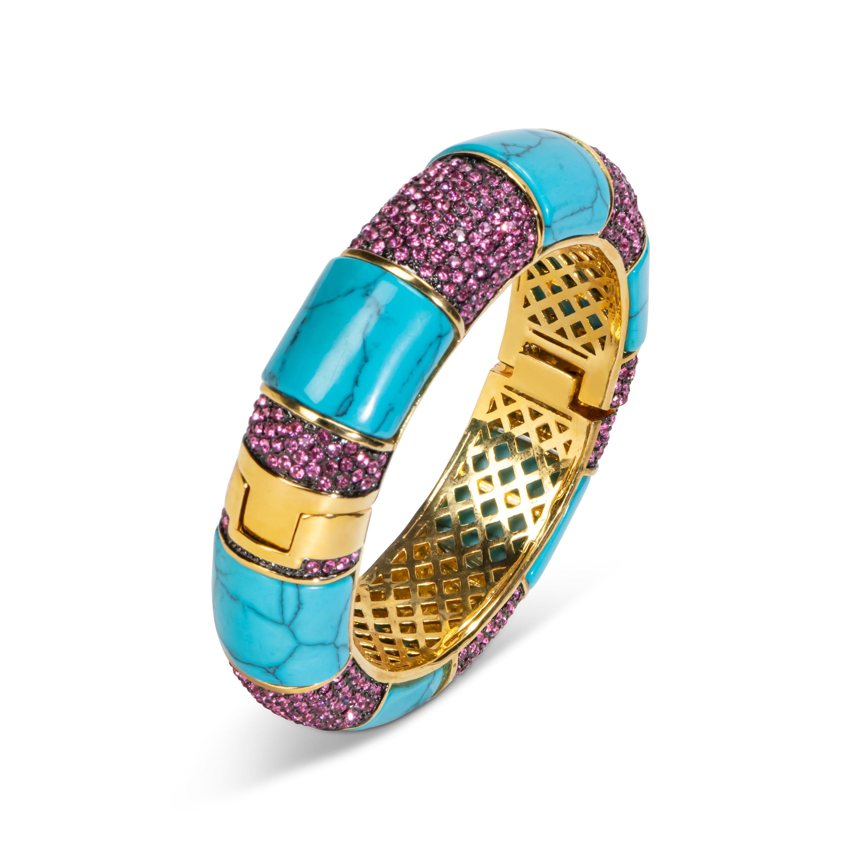 Bochic Ikon Bijoux Mughal cuff. 
Red crystals settings. 
Turquoise resin. 
Magnetic clasp  
8 inch diameter opening. 
Grill is gilded plating. 
Comes with a Bochic Velvet pouch. 