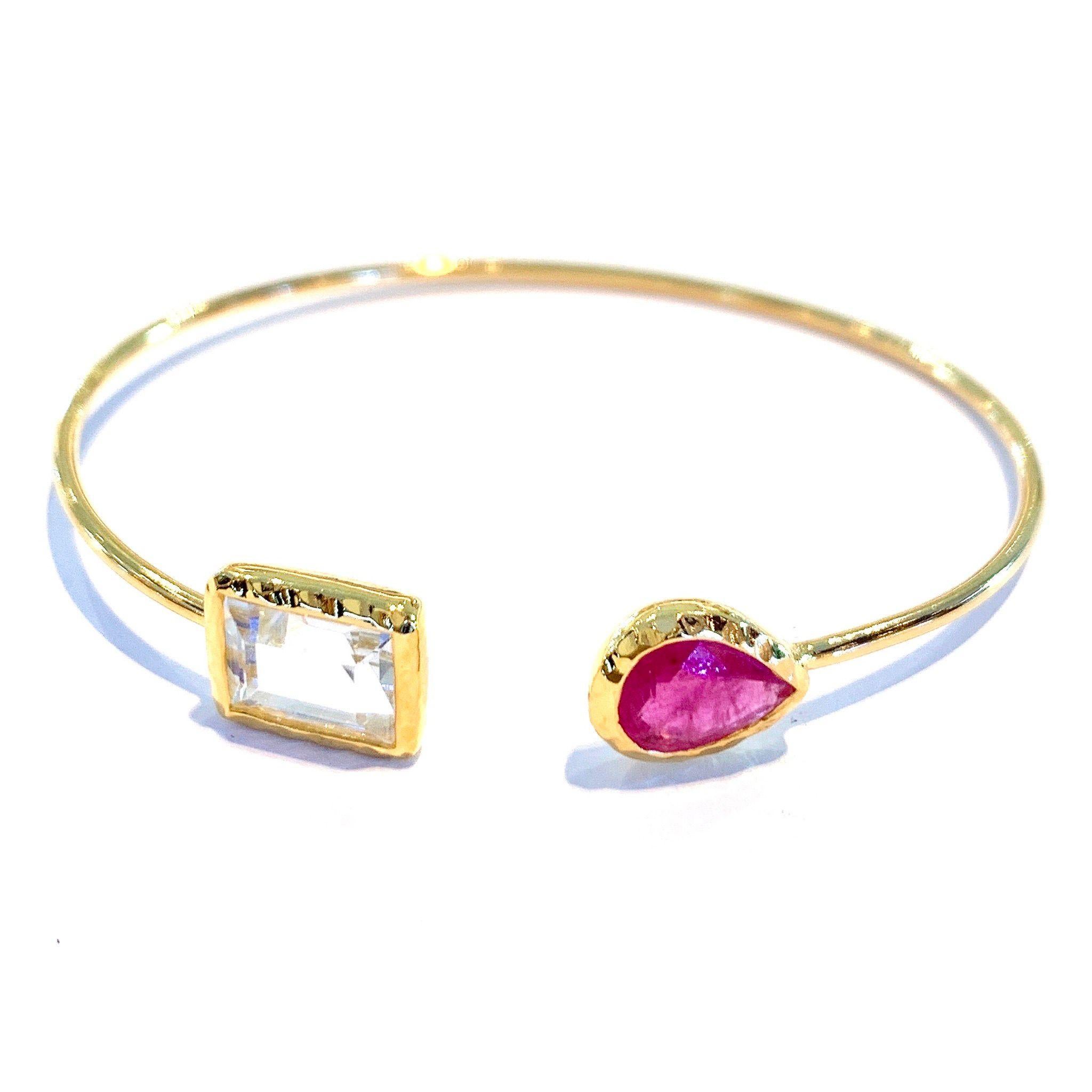 Bochic “Jungle” Bangle White step cut Topaz and Red Ruby 
Natural pear shaped ruby 
Natural white topaz 
22K gold and silver 
3 microns of gold 
This bangle is perfect to wear day to night by Itself or as a stackable
A perfect cross between fashion