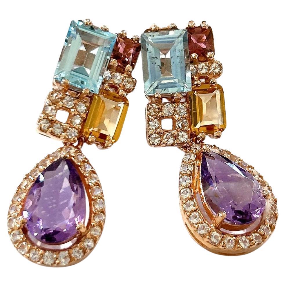 Bochic “Orient” Amethyst, Citrine & Blue Topaz Earrings Set 18K Gold&Silver 

Natural Yellow Citrine  - 2 carat 
Natural Blue Topaz - 4 carat 
Natural Purple Amethyst  - 6 carat 

The earrings from the 