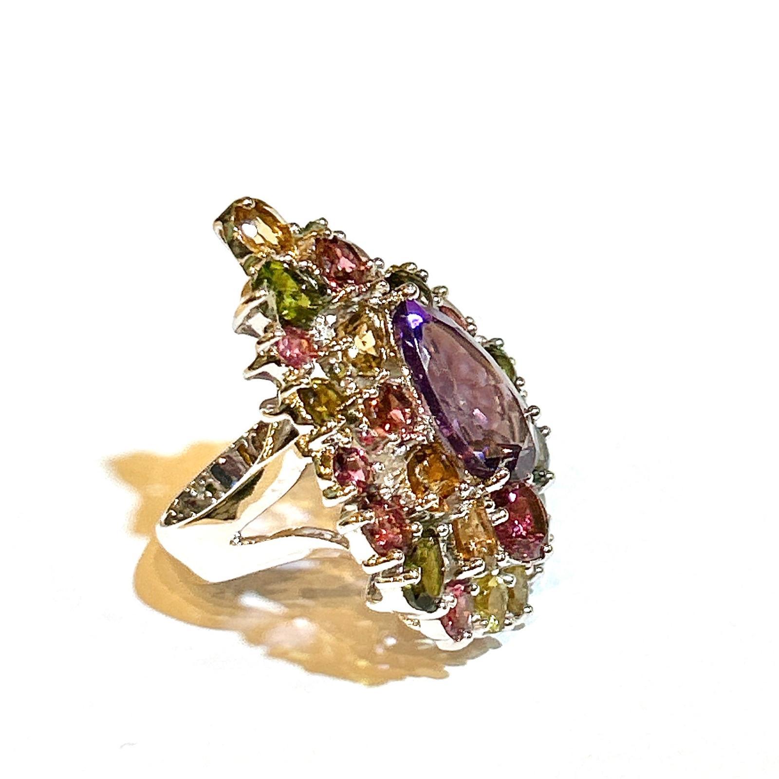 Bochic “Orient” Amethyst & Multi Tourmaline Cocktail Ring 18K Gold & Silver 

Natural Pear Shape Amethyst  - 7 Carat 
Natural Multi Color Tourmaline  - 17.50 Carat

This Ring is from the 