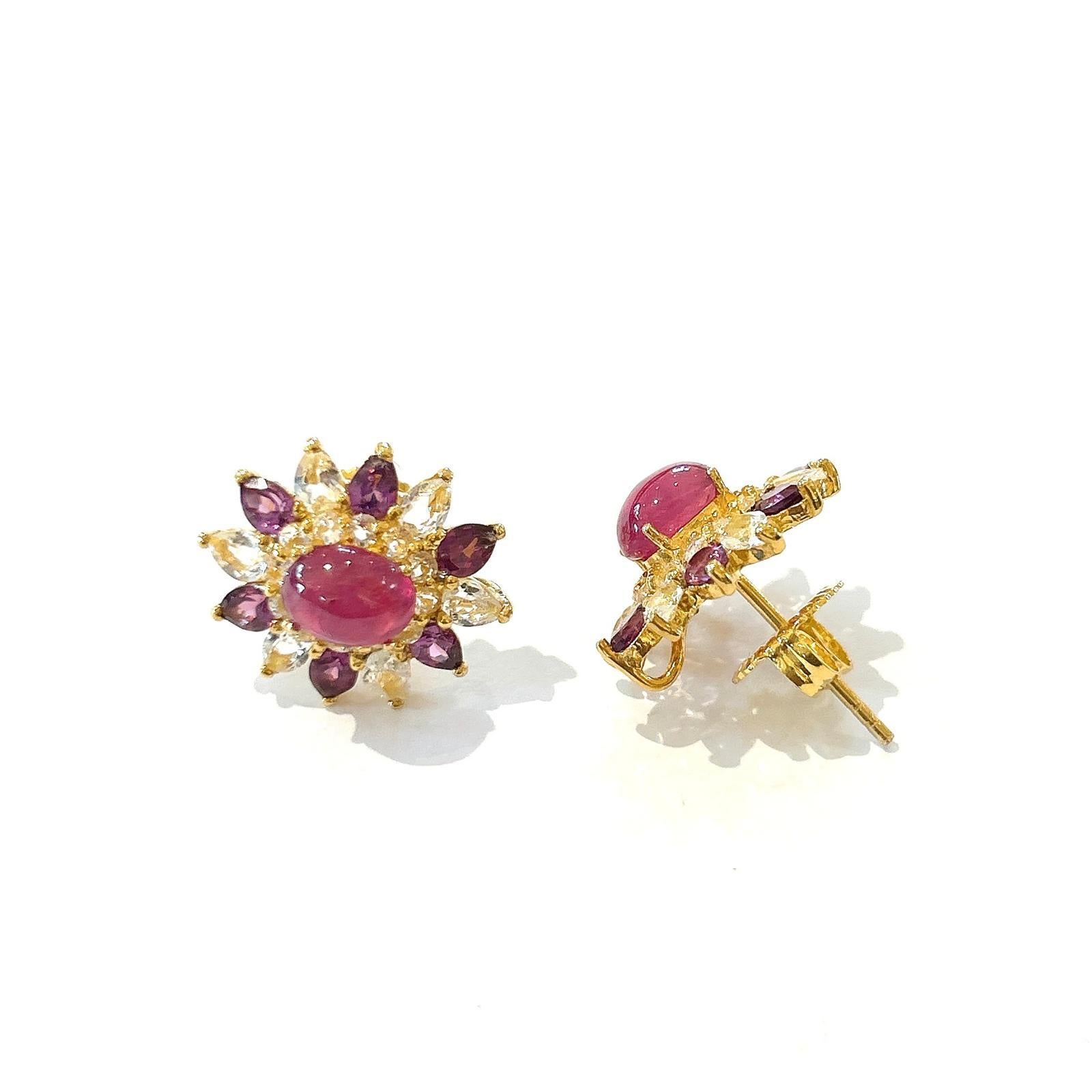 Bochic “Orient” Amethyst, Ruby & Topaz Set In 18K Gold & Silver Earrings

Natural Ruby Cabochons
5 carats 
Natural Amethyst Pear Shapes 
4 carats 
Natural White Topaz Rounds 
4 carats 

The earrings from the 