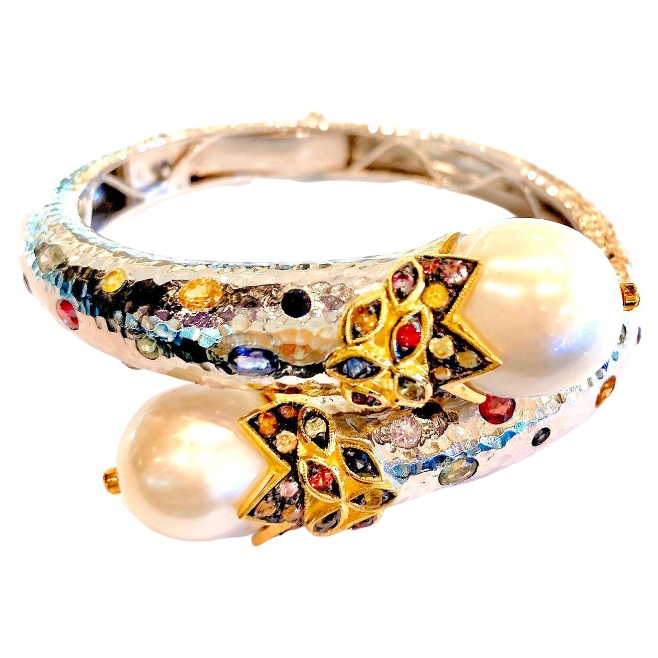 Bochic “Orient” Bangle set 22K Gold & Silver with Pearls & Sapphires 
White South Sea pearls white color, silver tone 
Natural Multi Color Sapphire from Sri Lankan  - 3 carats 
Sapphire colors, Red, Orange, Blue, Yellow and Pink
Set in 22K Gold and