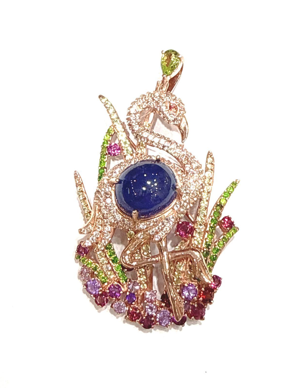 Bochic “Orient” Blue Sapphire, Amethyst & Peridot Brooch Set 18K Gold & Silver 

Can be worn as Brooch or Pendant 

Natural Sapphire - 5 carat  
Blue Sapphire 
Natural Amethyst - 2 carat 
Natural Garnet - 2 carat 
Natural Peridot - 2 carat 
Natural