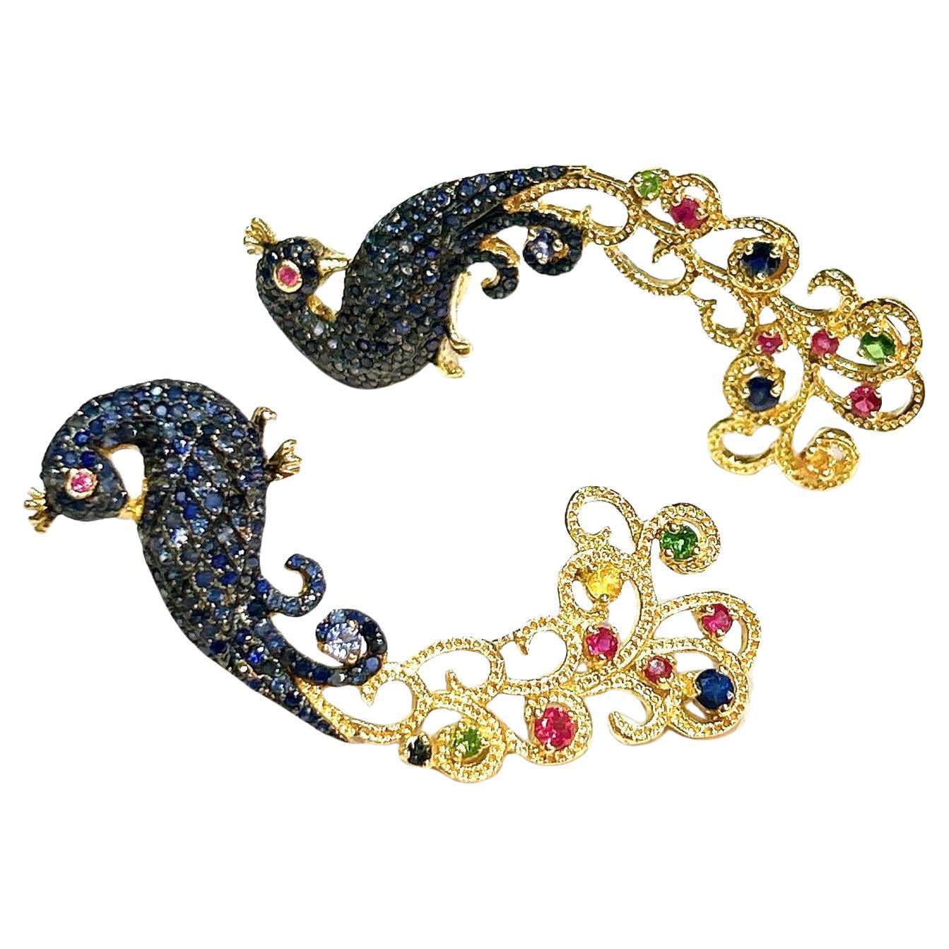 Bochic “Orient” Blue Sapphire & Multi Gem Peacock Earrings 18K Gold & Silver 

Natural Blue Sapphire - 4 carat 
Natural Yellow Sapphire  - 2 carat  
Natural Ruby - 2 carat 
Natural White Topaz - 2.00 carat 
Natural Green Amethyst - 2.00 carat 

The