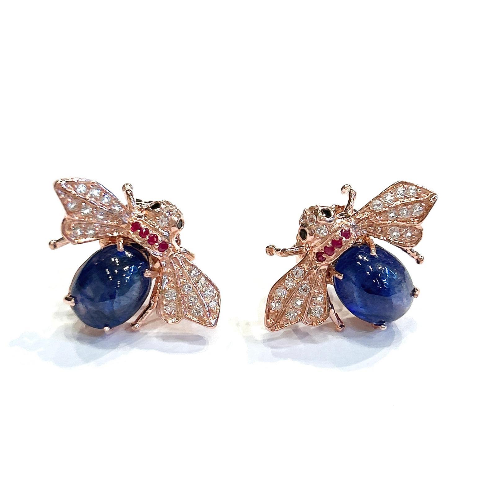 Bochic “Orient” Blue Sapphire & Ruby Earrings Set In 18K Yellow Gold & Silver

Natural Blue Sapphire - 4 carats 
Natural White Topaz - 1 carats 
Natural Ruby - 0.30 carats 

The earrings from the 