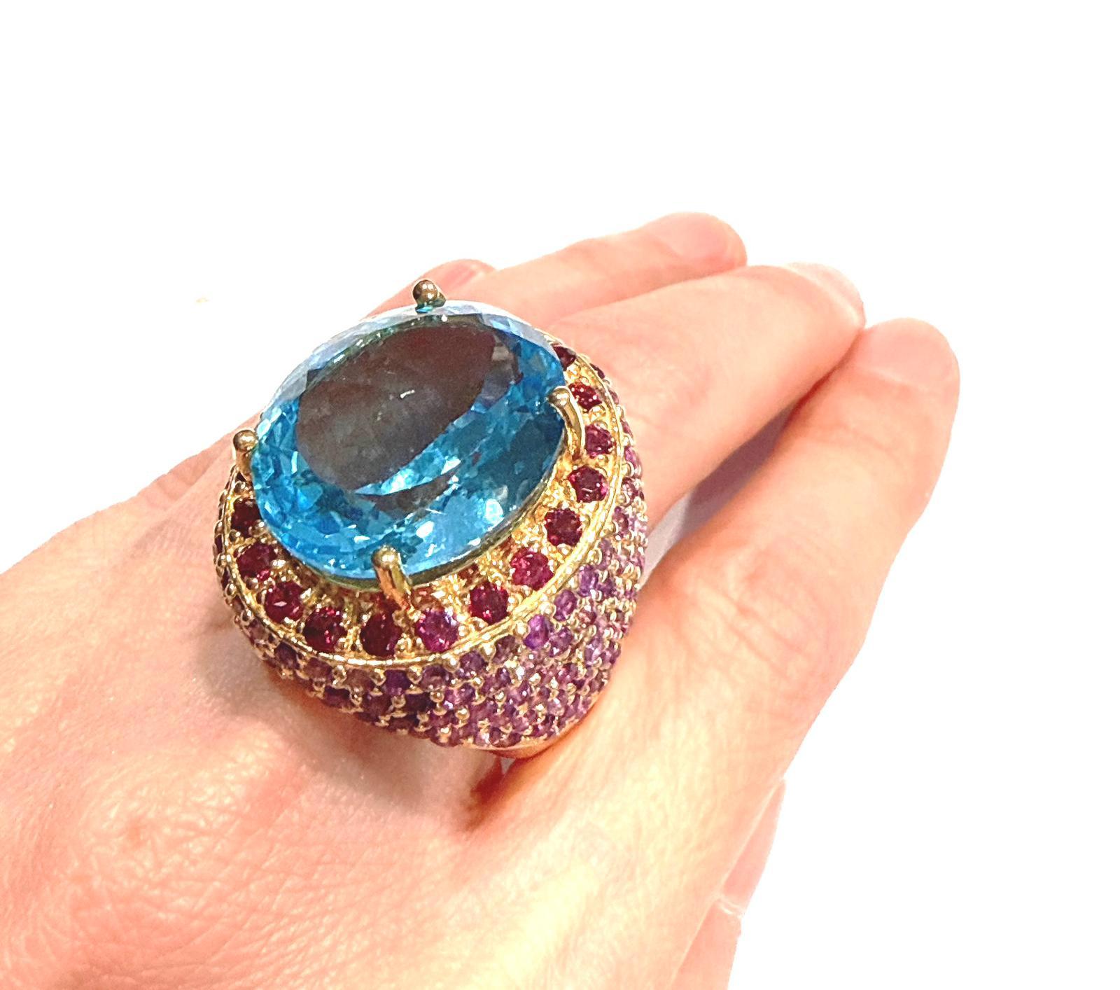 Bochic “Orient” Blue Topaz & Multi Gem Cocktail Ring Set In 18K Gold & Silver 

Natural Blue Topaz Oval Shape  - 8 Carat
Natural Rose Rodorite - 3 Carat 
Natural White Topaz - 1 Carat 

This Ring is from the 
