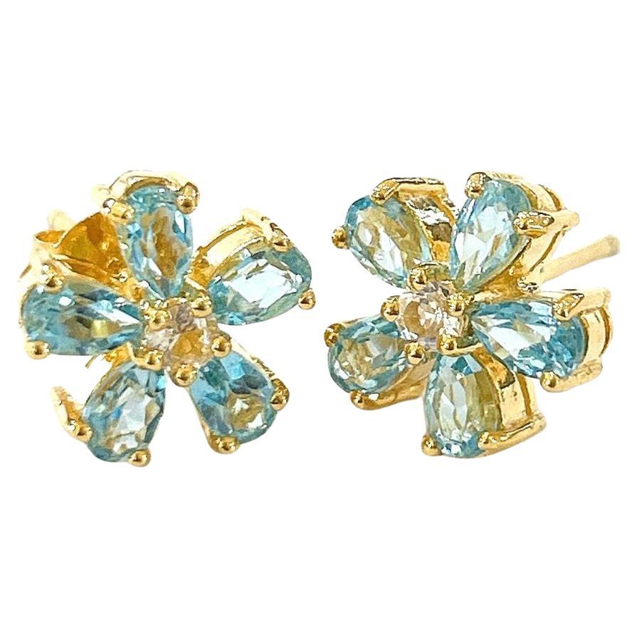 Bochic “Orient” Blue & White Topaz Earrings Set In 18K Gold & Silver 

Natural Blue Topaz - 6 carat  
Natural White Topaz - 1 carat

The earrings from the 