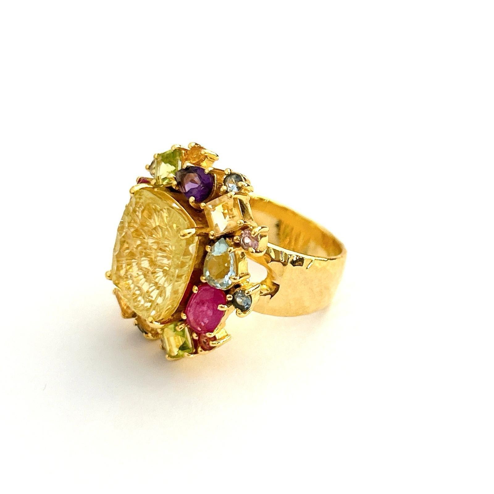 Bochic candy cocktail multi gem ring set in 18k gold & silver

Center square cut Citrine 
5 carat 
Multi gem, ruby, topaz, amethyst 
4 carats

This Ring is from the 
