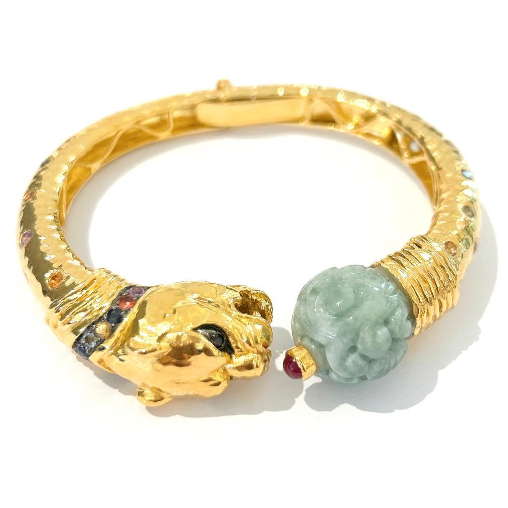 Bochic “Orient” Carved Vintage Mint Jade Bangle Set In 18K Gold & Silver

Multi color sapphires from Sri Lanka 
0.50 Carat 
Colors: Pink, Orange, Blue, Rose, Yellow, Green 

The bangle has an open and close flex leaver and fits perfectly. 

This