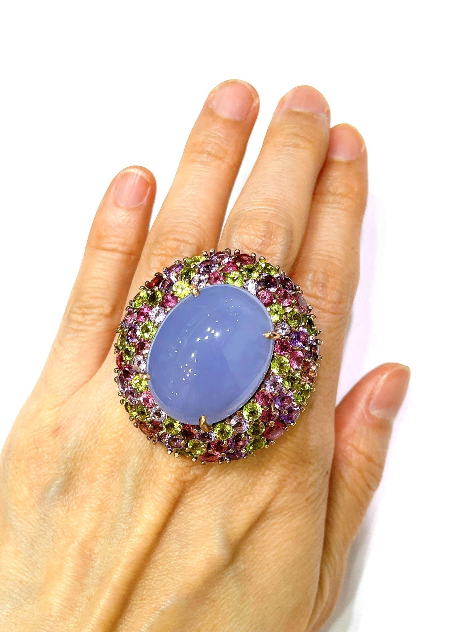 Bochic “Orient” Chalcedony  & Multi Gem Cocktail Ring In 18K Gold & Silver 

Natural Chalcedony Cabochon - 7 Carat 
Natural Tanzanites
Natural Amethyst 
Natural Peridot  
6 Carat 

This Ring is from the 