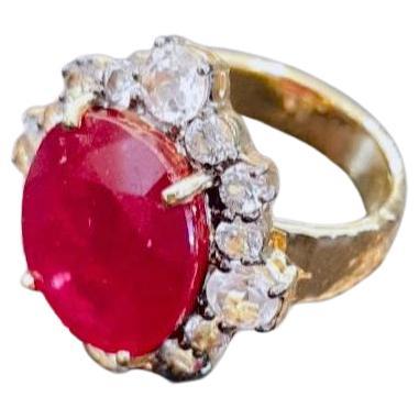Bochic “Orient” Cluster Cocktail Natural African Ruby Ring 
African Natural Gem cut Ruby - 9 Carat 
Shape - Oval shape 
Rose cut Natural white topaz cluster gems - 3 Carat 
18K gold and Silver 

This Ring is from the 