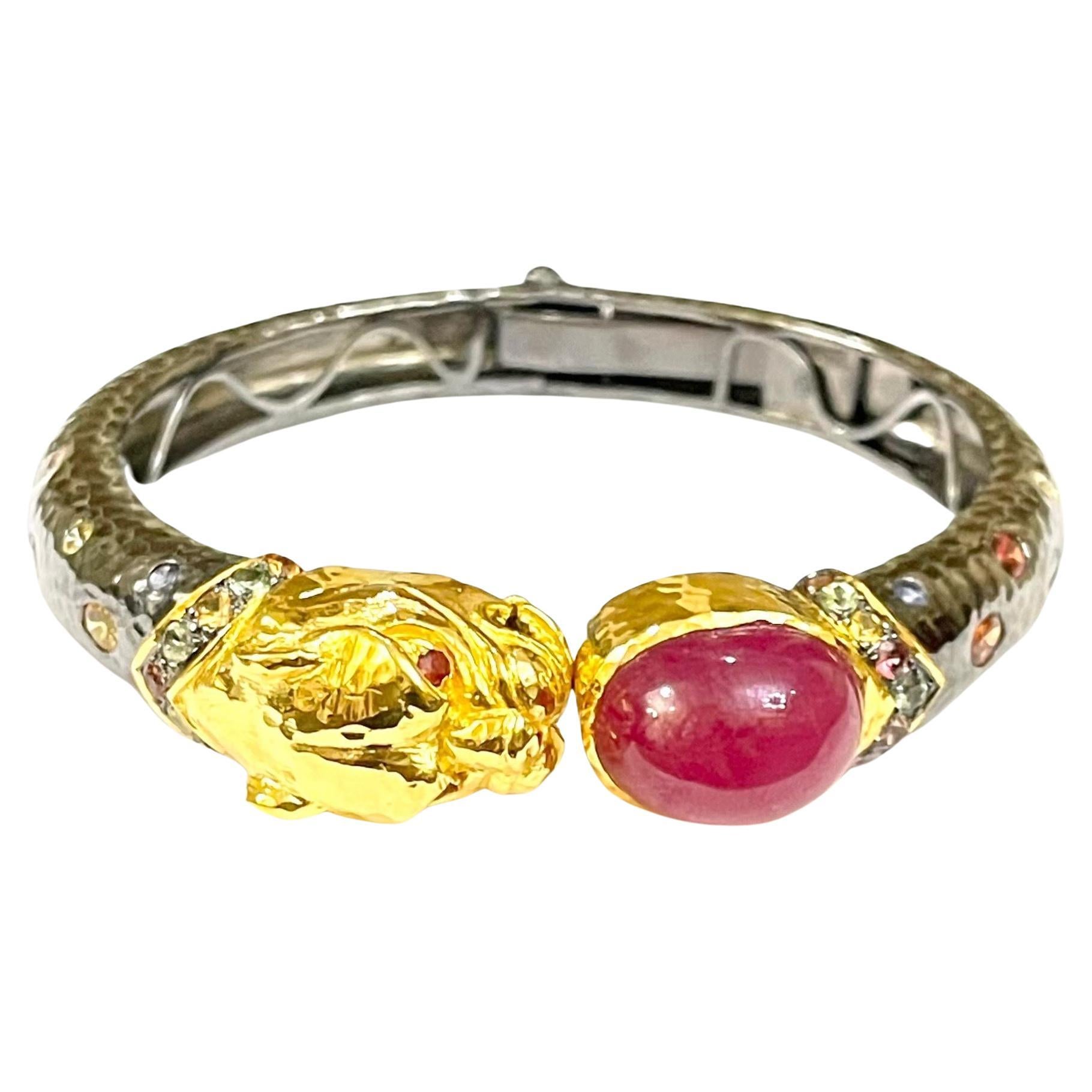 Bochic “Orient” Bangle set 22K Gold & Silver Ruby & Sapphires 
Natural Multi Color Sapphire from Sri Lanka  - 3 carats 
Sapphire colors, Red, Orange and Pink
Red Natural Ruby Cabochon - 21 Carats 
Set in 22K Gold and Silver 950
This Bangle is