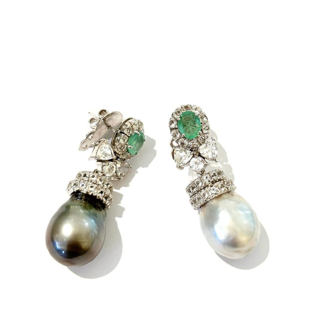 Bochic “Orient” Emerald & South Sea Pearl Earrings Set In 18K Gold & Silver 

Natural Oval Shapes Emeralds from Zambia 
4 carats 
White Natural Topaz 
4 carats 
South Sea Baroque Peals White and Black Colors 


The earrings from the 