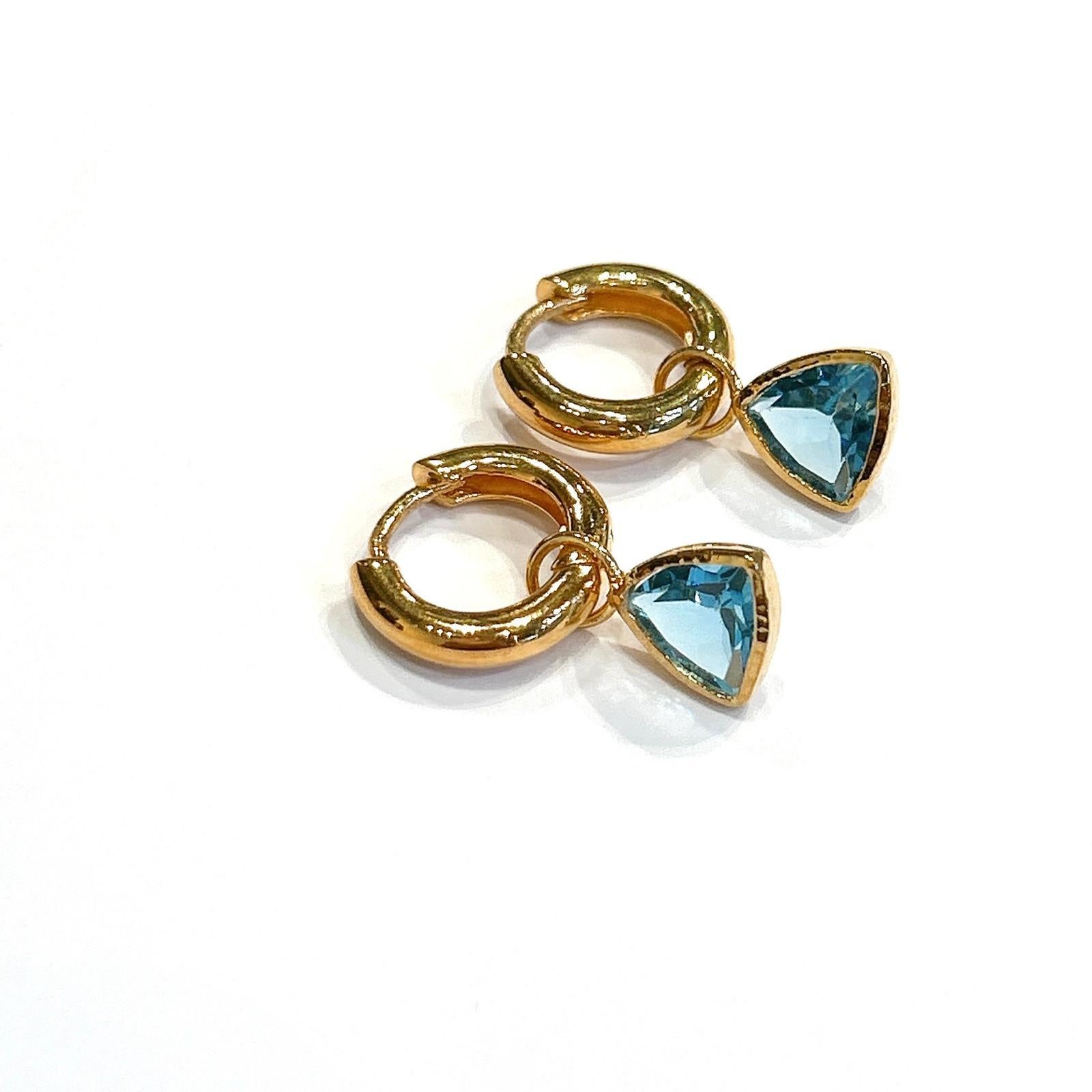 Bochic “Orient” Opal, Ruby, Sapphire & Multi Gem Earrings Set 18K Gold & Silver 

Natural Blue Topaz Trillion 
3 carat 

The earrings from the 