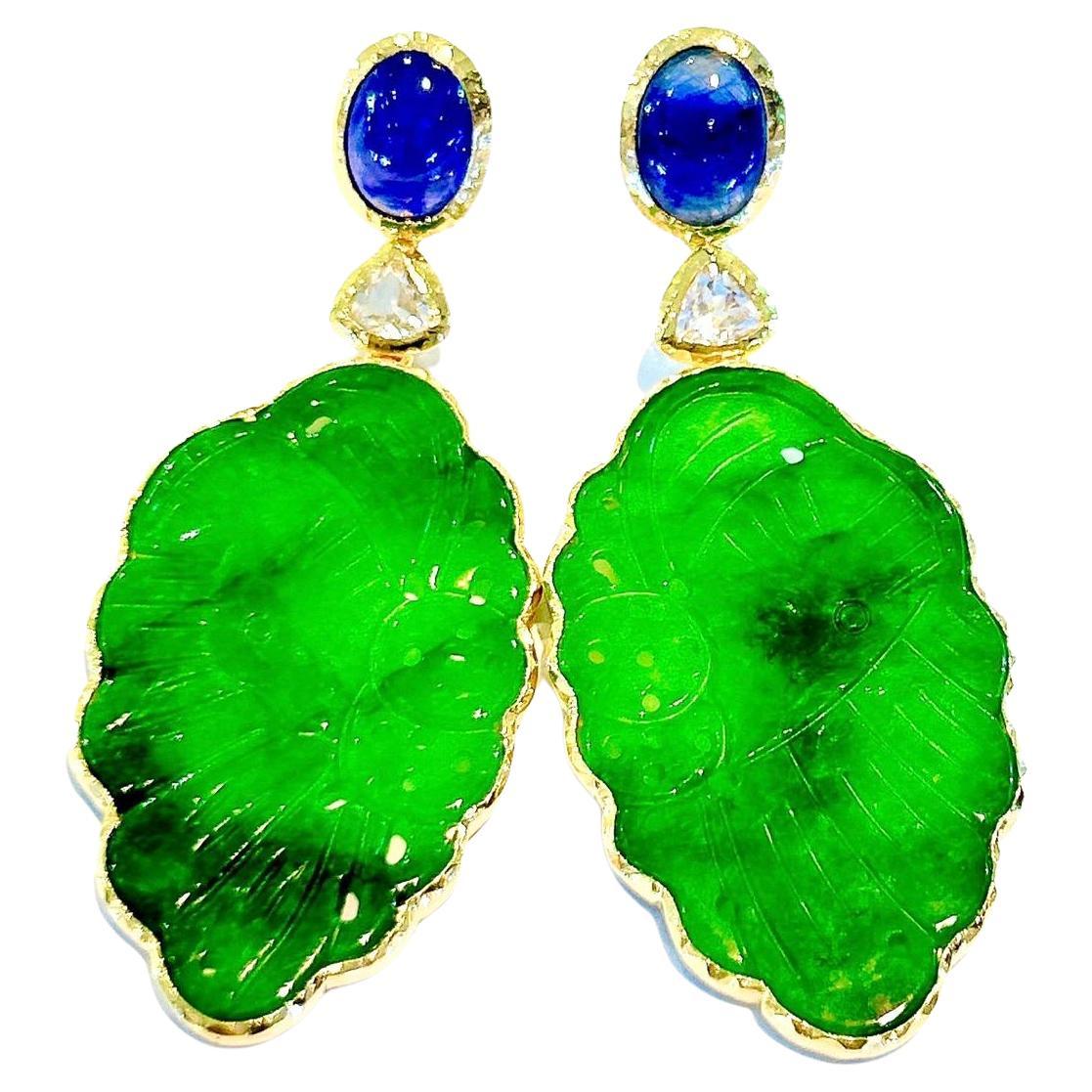 Bochic “Orient” Jade & Sapphire Earrings set in 22K Gold & Silver 
Green Carved Jade  - 30 carats in total
Natural Deep Blue Sri Lankan Sapphires 
Shape - Cabochon
14 Carats 
Natural White Topaz - 5 carats in total 
Shape - Trillion
Set in 22K Gold