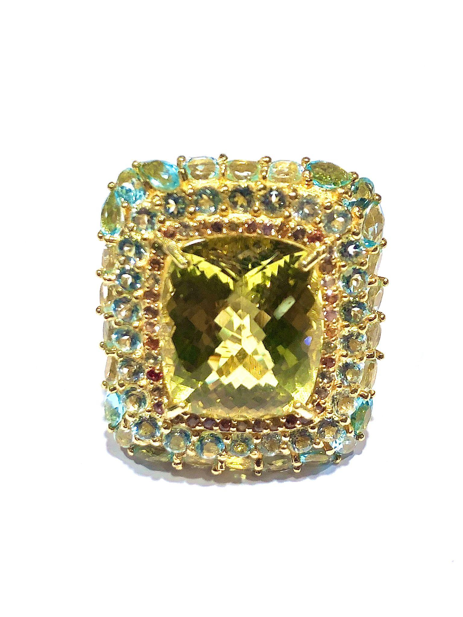 Bochic “Orient” Lemon Quartz, Topaz & Peridot Cocktail Ring Set 18K Gold&Silver

Natural Center Lemon Greenish Quartz 
13.00 Carat 
Natural Round Brilliant Multi Peridot, Blue Topaz and Lemon Quartz 
6.00 Carat 

This Ring is from the 