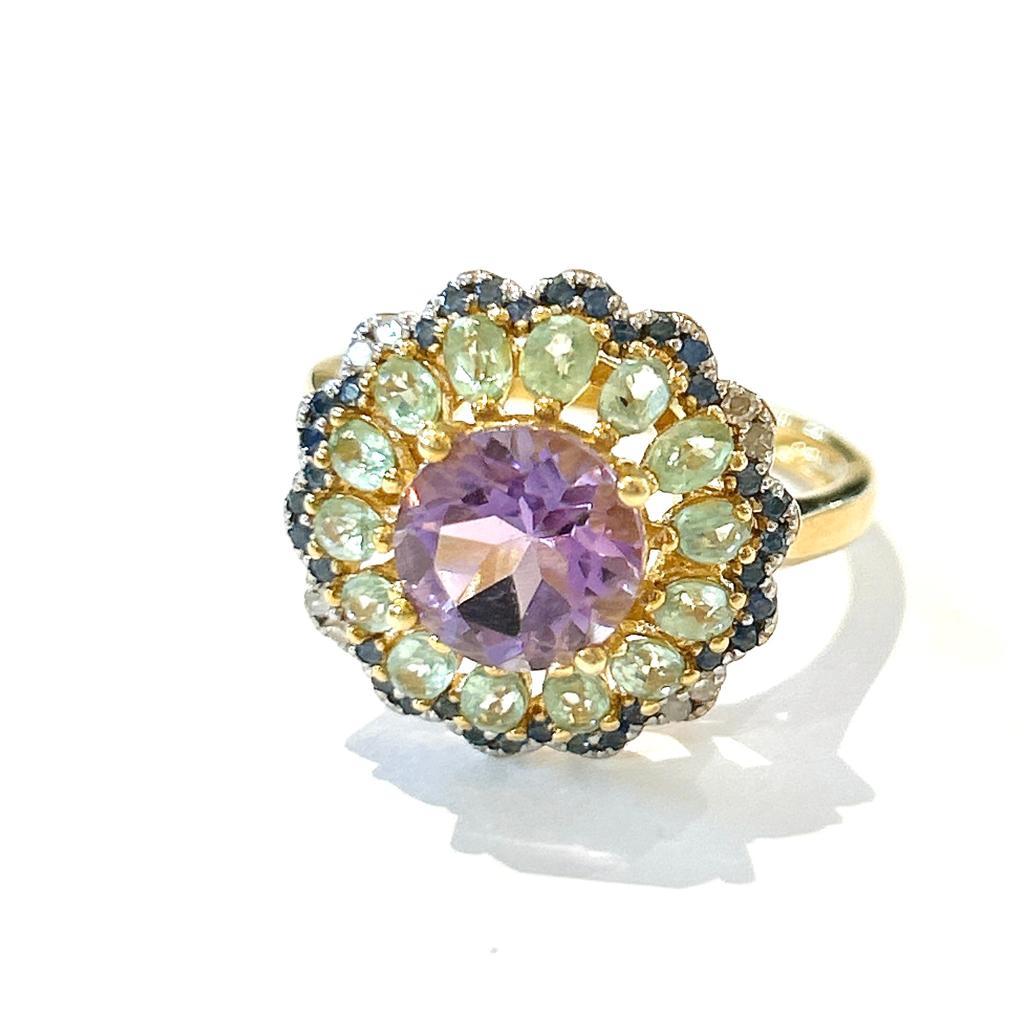 Bochic “Orient” Multi Gem Cocktail Ring Set In 18 K Gold & Silver 

Purple Natural Amethyst, round center stone, 10 Carat
Blue Natural Sapphires from Sri Lanka - 1 Carat 
Green Natural Oval Shape Emeralds from Zambia - 8 Carat 


This Ring is from