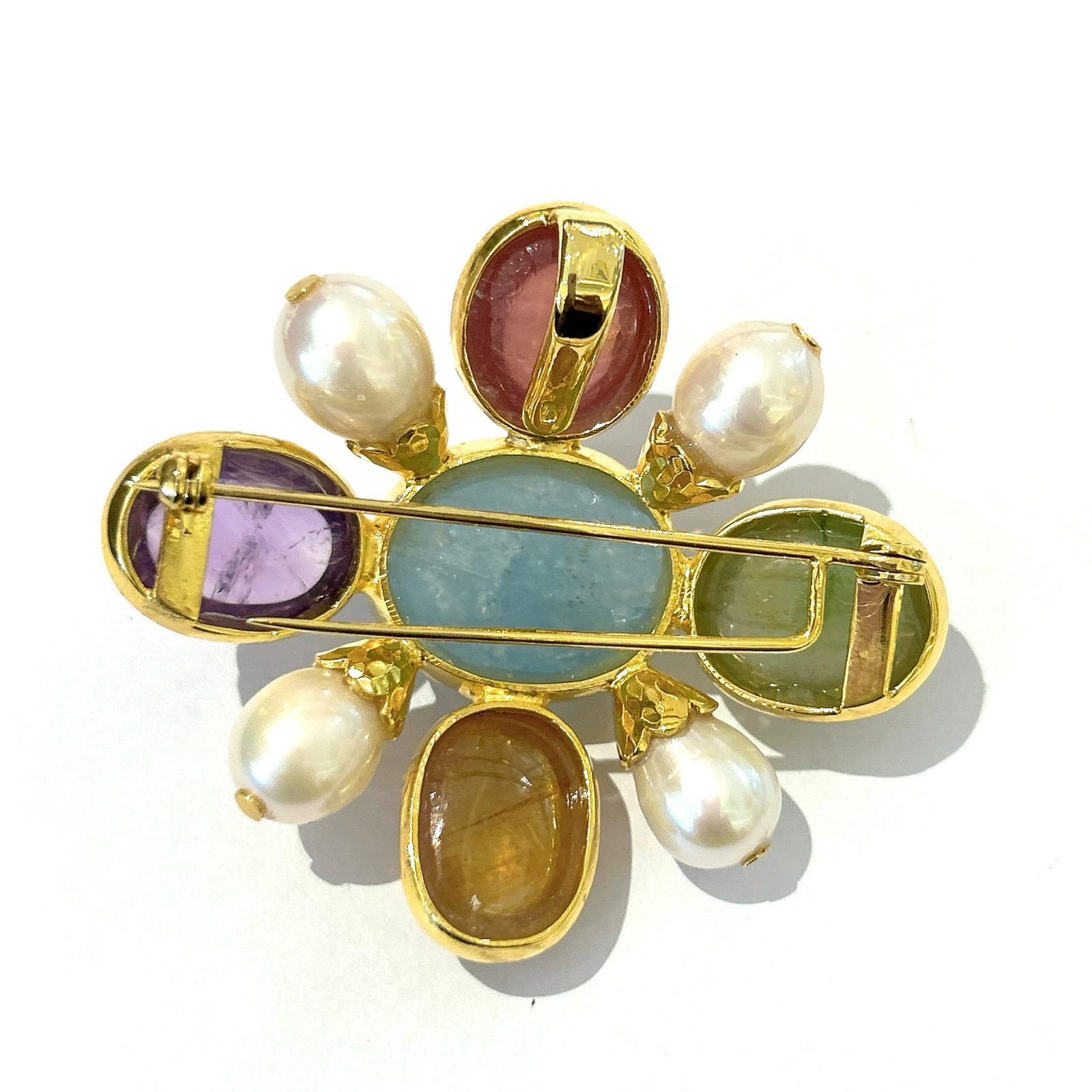 Bochic “Orient” Italian Multi Sapphires & Multi Gem Brooch Set In 18K Gold & Silver 

Natural Aquamarine, Oval shape - 25 carat 
Natural Sapphires from Sri Lanka 
51 carat
Natural Amethyst - 14 Carat  
White South Sea Pearls 

The Brooch is from the