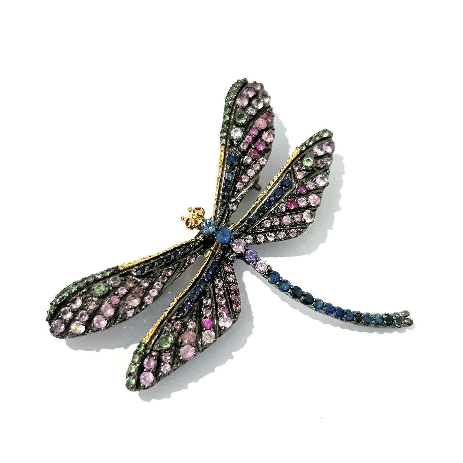 Bochic “Orient” Multi Sapphires & Ruby Brooch Set In 18K Gold & Silver 

Can be worn as a brooch and a pendant 

Natural light Fancy Pink/Red Ruby  - 1 carat 
Multi color Natural Sapphires from Sri Lanka 
3.carat

The Brooch is from the 