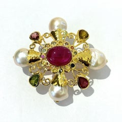 Broche Bochic Orient multi saphirs et rubis sertie en or et argent 18 carats