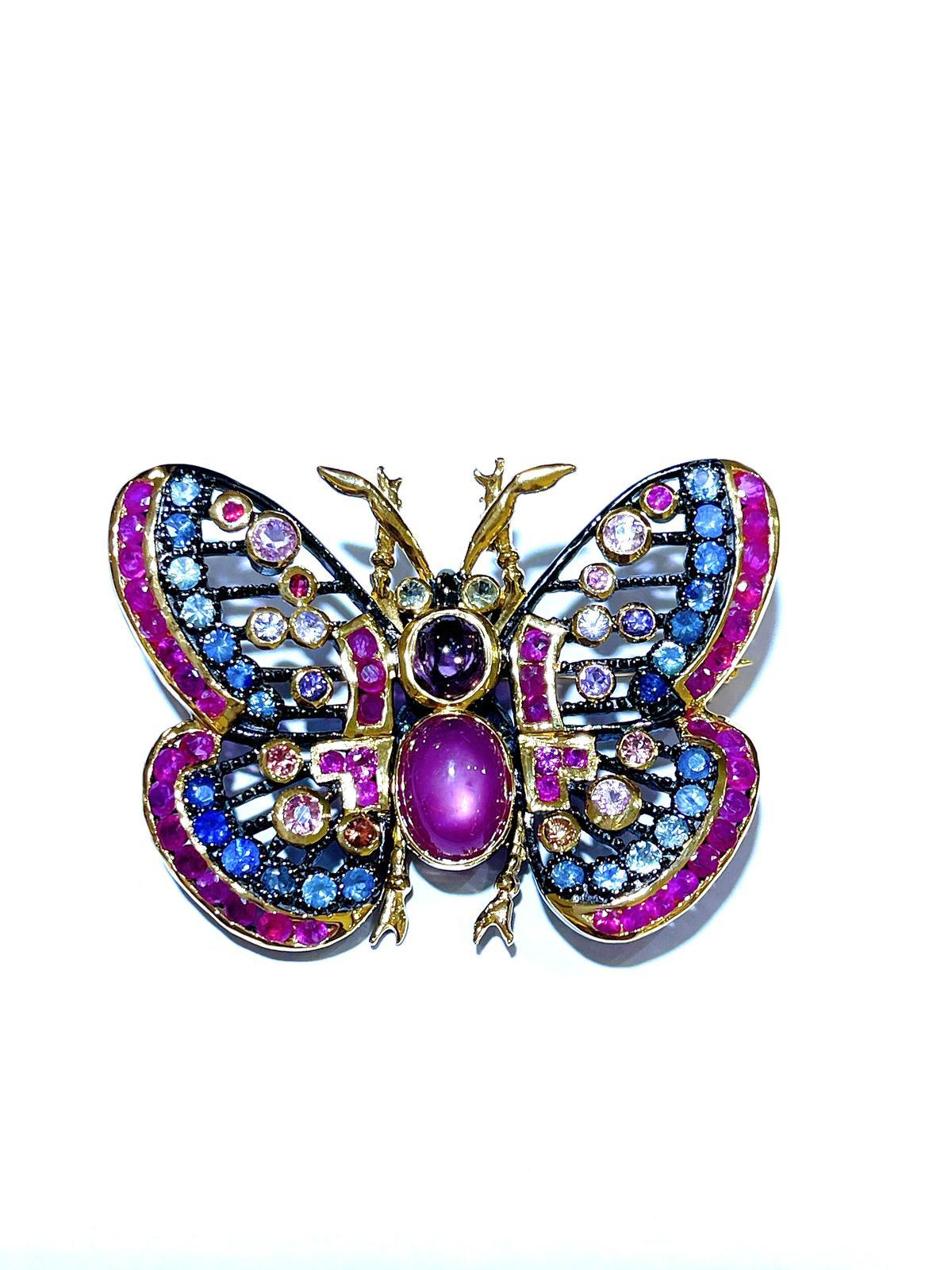 Bochic “Orient” Multi Sapphires & Ruby Butterfly  Brooch Set In 18K Gold & Silver 

Can be worn as a brooch and a pendant 

Natural Red Ruby  - 4.60 carat 
Multi color Natural Sapphires from Sri Lanka 
2.50 carat
Natural Spinal - 1.65 carat 

The