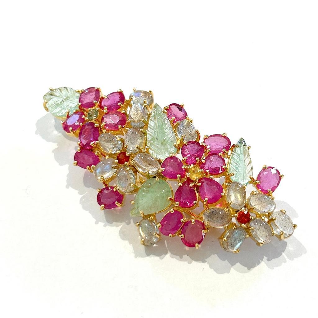 Bochic “Orient” Multi Sapphires, Ruby & Emerald Brooch Set In 18K Gold & Silver 

Natural Red Ruby  - 8 carat 
Multi color Natural Sapphires from Sri Lanka 
1 carat
Natural Green Emerald from Zambia - 4 Carat 
Natural Labradorite - 8 Carat

The
