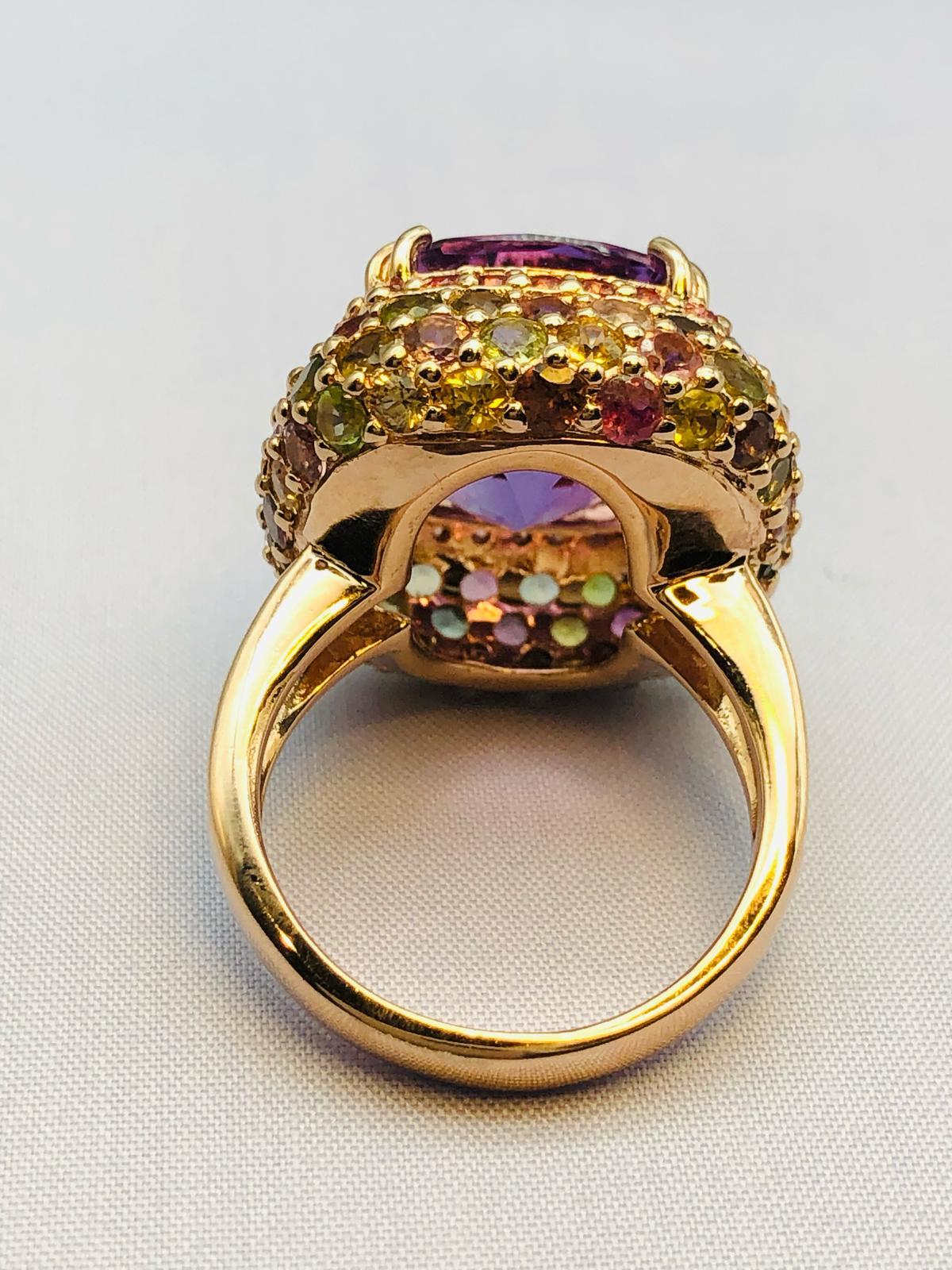 Bochic “Orient” Natural Amethyst & Multi Sapphire Ring Set In 18K Gold & Silver 

Natural Amethyst  - 7.50 Carat 
Natural Round Brilliant Multi Color Fancy Sapphire  
4.00 Carat 
Natural Red Spinal - 1.00 Carat 

This Ring is from the 