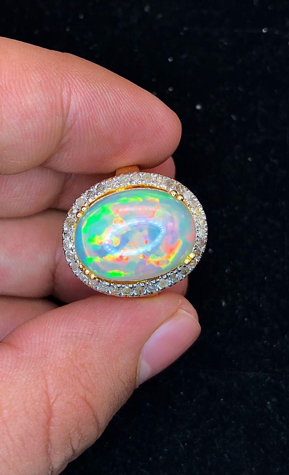 Bochic “Orient” Natural Diamond & Fire Opal Ring Set In 18K Gold & Silver 

Natural Fire Opal - 9.50 Carat 
Natural Round Brilliant Cut Diamonds
2.00 Carat

This Ring is from the 