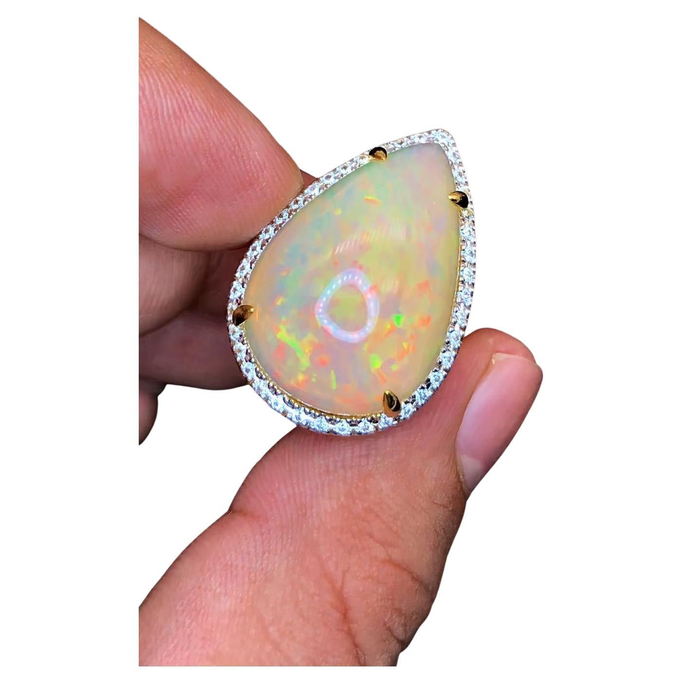 Bochic “Orient” Natural Diamond & Fire Opal Ring Set In 18K Gold & Silver 

Natural Pear Shape Fire Opal - 14.50 Carat 
Natural Round Brilliant Cut Multi Fancy Color Diamonds
1.00 Carat

This Ring is from the 