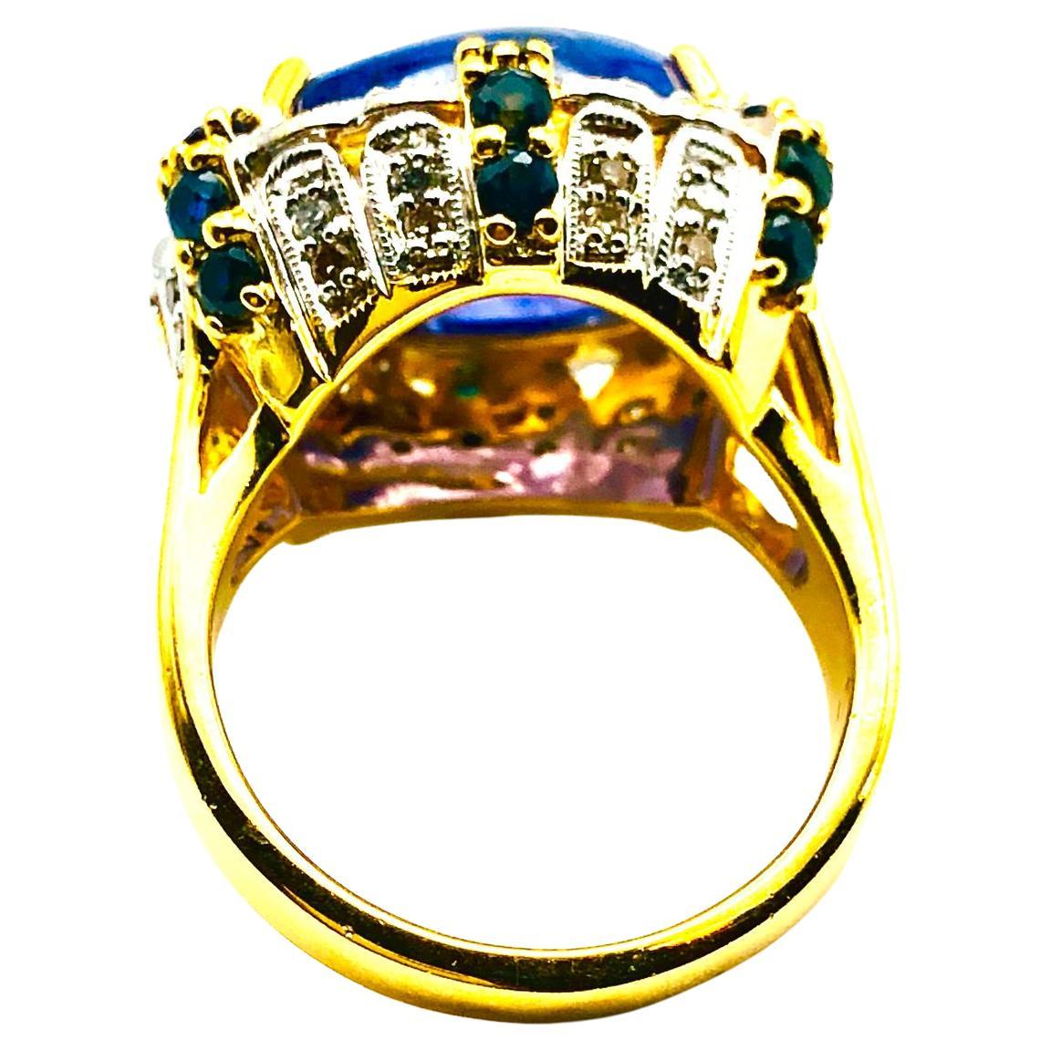 Bochic “Orient” Natural Vintage Diamond, Blue Sapphire & Tanzanite Cocktail Ring Set In 18K Gold & Silver 

Natural Cabochon Tanzanite 9.50 Carat 
Natural Round Brilliant Cut Fancy Yellow Diamonds 
1.00 Carat
Natural Round Brilliant Blue Sapphire  -