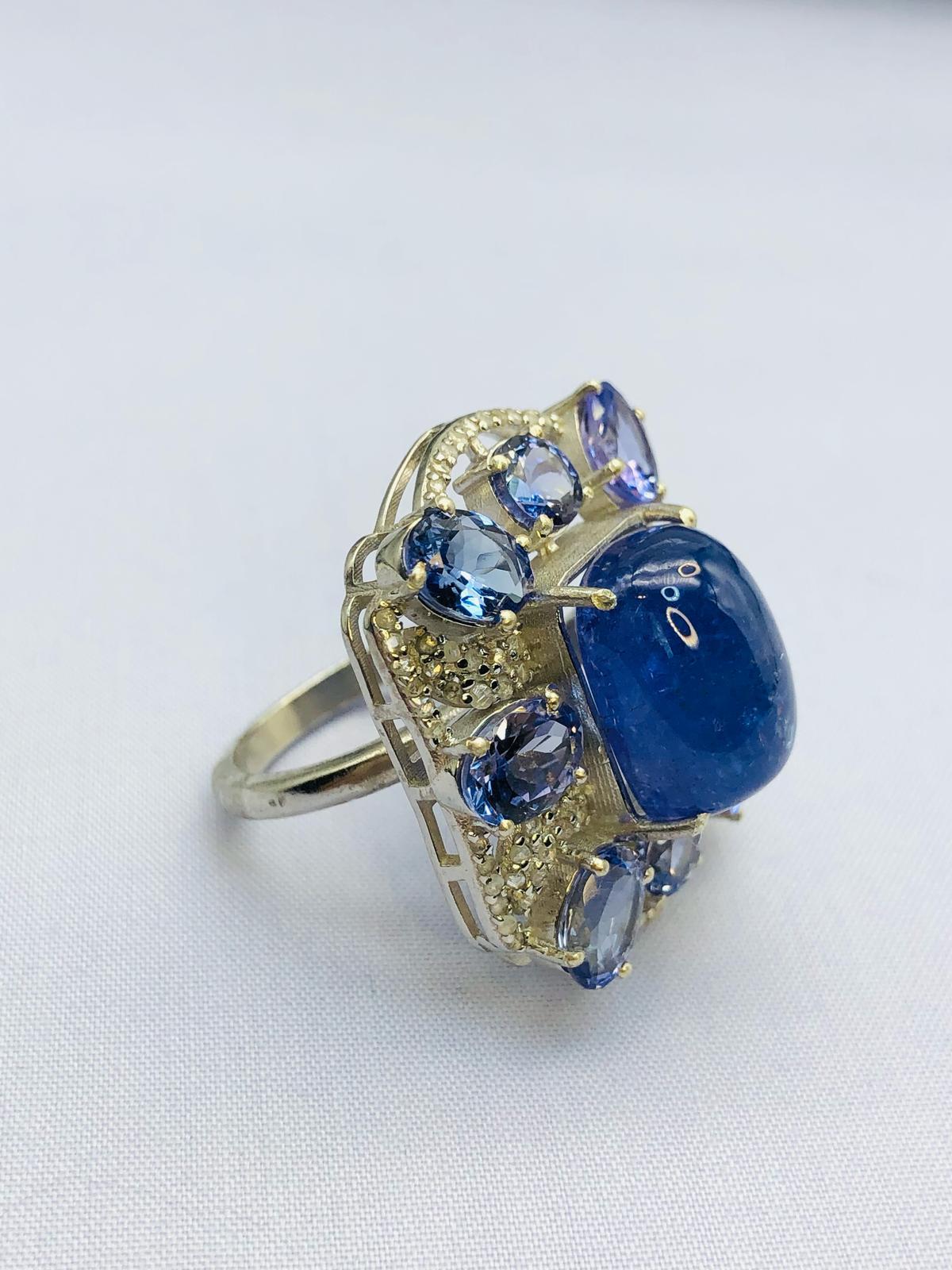 Bochic “Orient” Natural Diamond & Tanzanite Cocktail Ring Set In 18K Gold & Silver 

Natural Cabochon Tanzanite 7.50 Carat 
Natural Round Brilliant Cut Diamonds 
2.00 Carat
Natural Round Brilliant Tanzanite - 6.00 Carat 

This Ring is from the