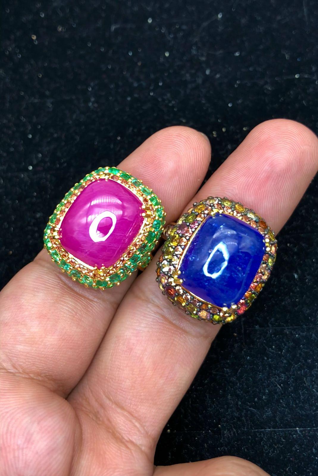 Bochic “Orient” Natural Emerald, Ruby & Sapphire Rings Set,  18K Gold & Silver

Ring 1 - Natural Cabochon Ruby - 17.50 Carat 
Natural Round Brilliant Emeralds  - 2.00 Carat 
Natural Yellow Sapphire  - 1.00 Carat

Ring 2 - Natural Cabochon Blue