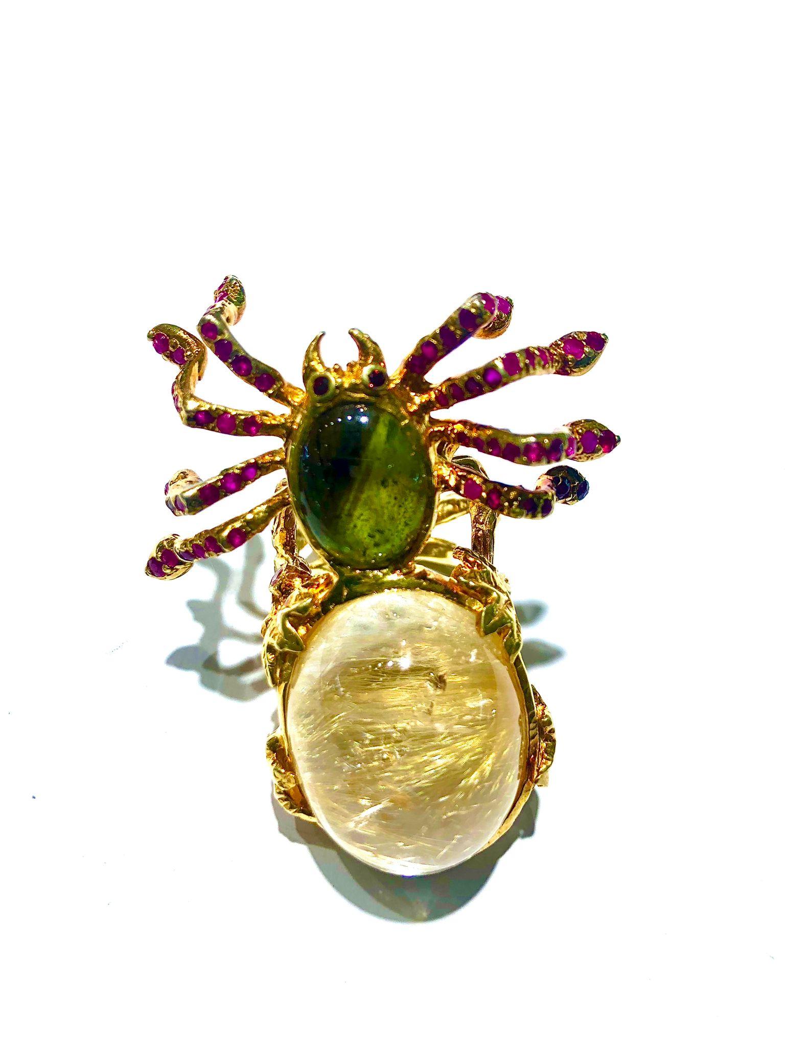 Bochic “Orient” Natural Ruby & Green Tourmaline Spider Ring Set In 18K Gold&Silver

Natural Center Rutile Quartz 
19.00 Carat 
Natural Center Green Tourmaline
6.00 Carat
Natural Round Brilliant Multi Rubies
2.00 Carat 

This Ring is from the
