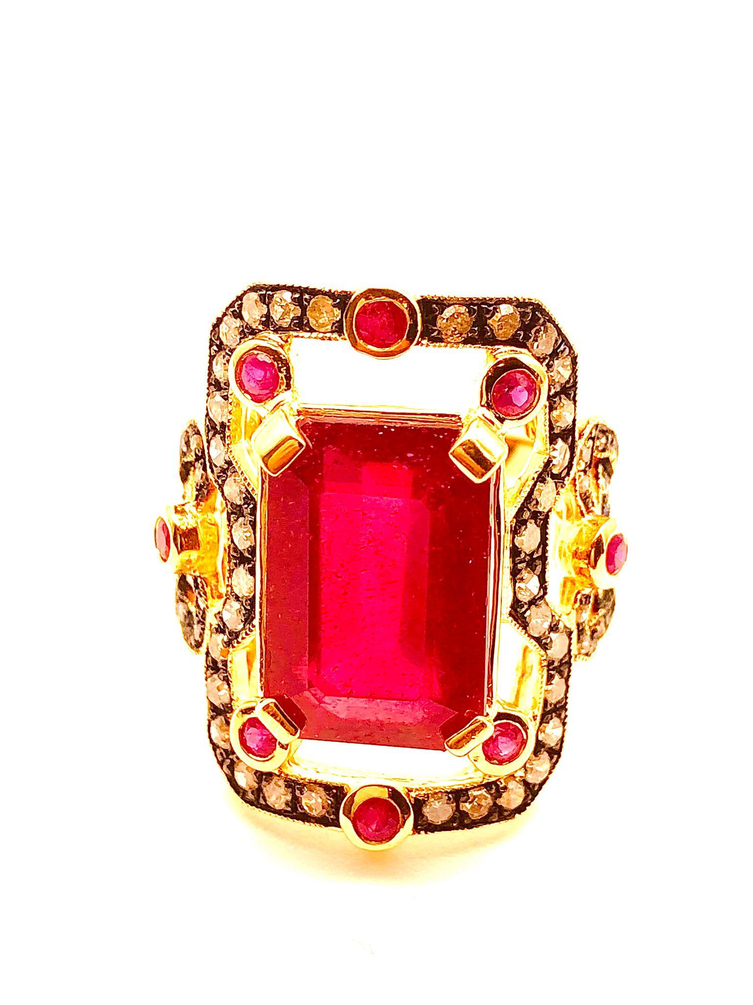 Bochic “Orient” Natural Ruby & Natural Diamond Ring Set In 18 K Gold & Silver 

Natural Emerald Shape Center Ruby
6.00 Carat 
Natural Diamonds 
1.00 Carat 
Natural Round Shape Rubies 
1.00 Carat 

This Ring is from the 