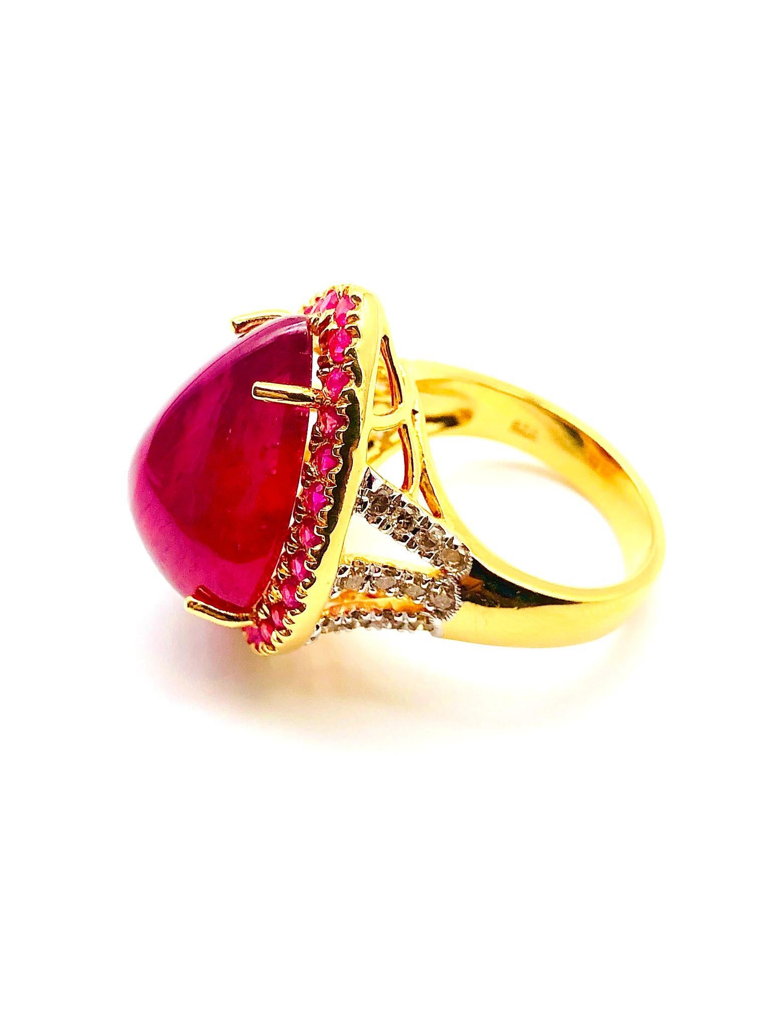 Bochic “Orient” Natural Ruby & Natural Diamond Ring Set In 18K Gold & Silver 

Natural Pear Shape  Ruby
15,00 Carat 
Natural Diamonds 
1.00 Carat 
Natural Round Rubies 
3.00 Carat 

This Ring is from the 