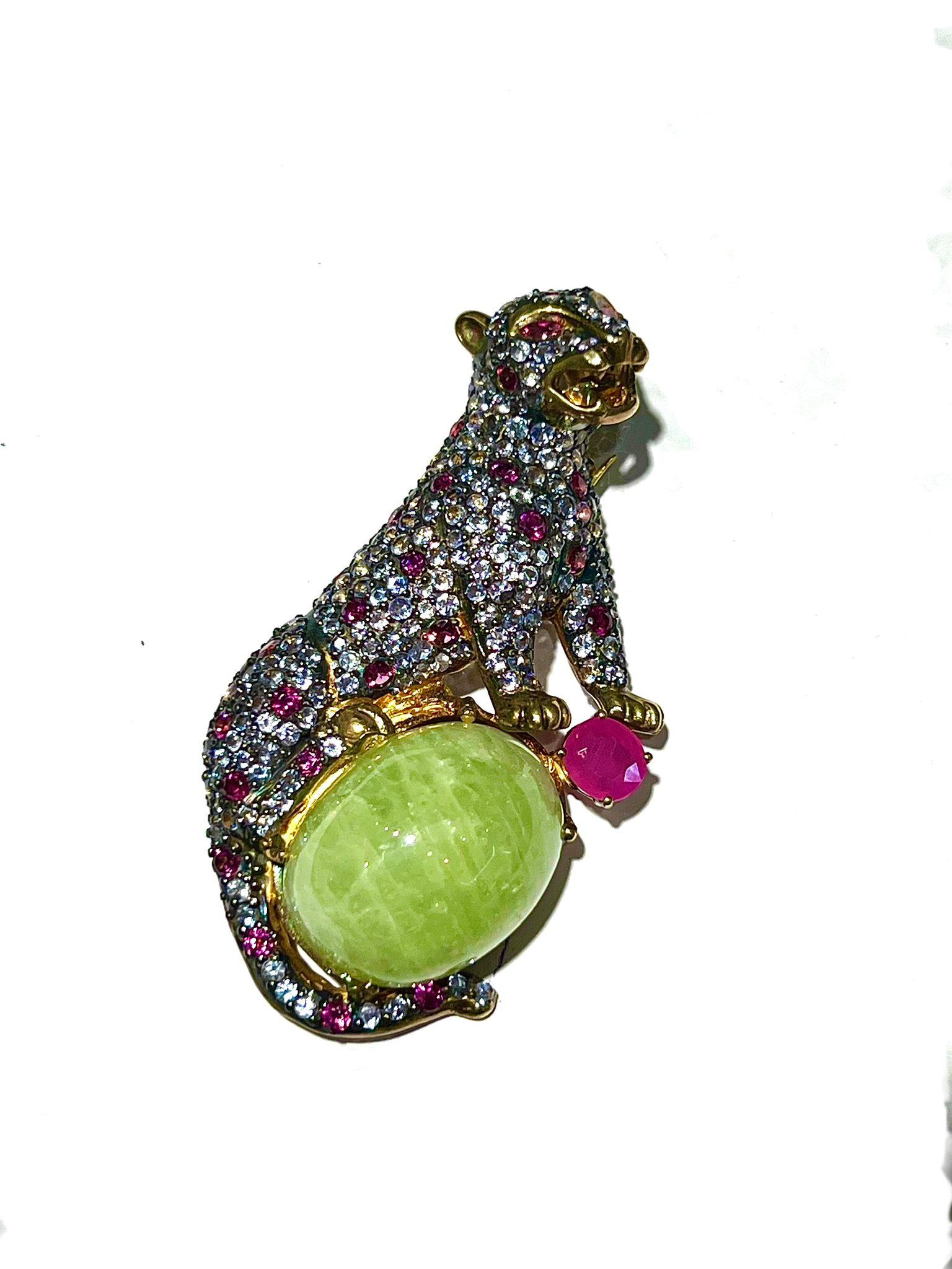 Bochic “Orient” Natural Ruby, Sapphire & Green Jade Brooch or Pendent Set In 18K Gold & Silver 

Natural Multi Sapphire 
3 carats 
Natural Green Calcite 
15 carats 
Natural Ruby
3 carats 

Can be worn as a pendent as well. 

The Brooch is from the