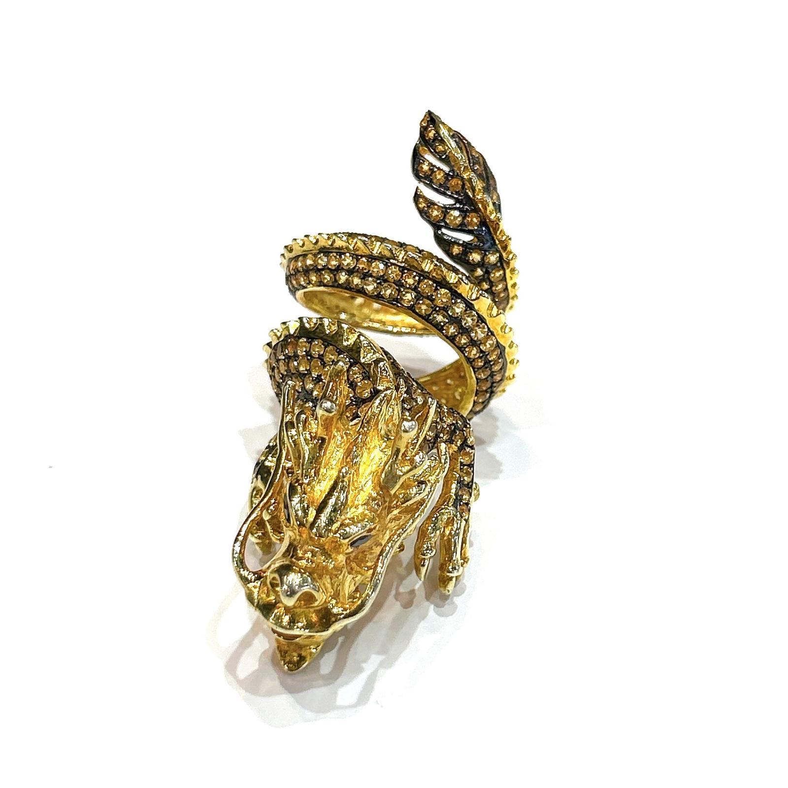 Bochic “Orient” Neoclassical Dragon Yellow Sapphire Ring Set 18K Gold & Silver

Fantastic Oriental-style ring inspired by CARTIER Iconic Neoclassical “Dragon” Collection

Natural Yellow Sapphire  - 3 carats 
22.3 gram 

This Ring is from the